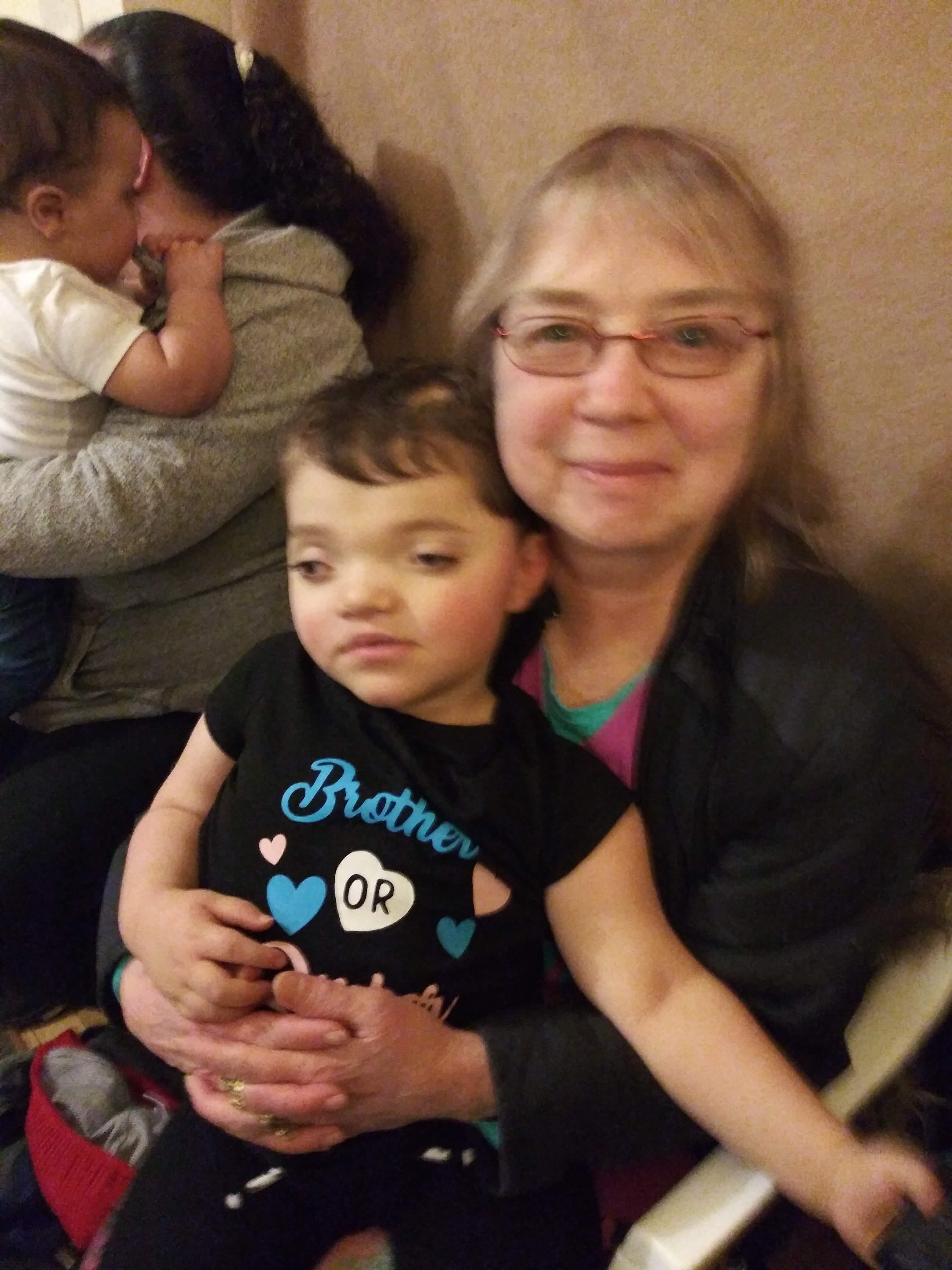 A woman holding a child