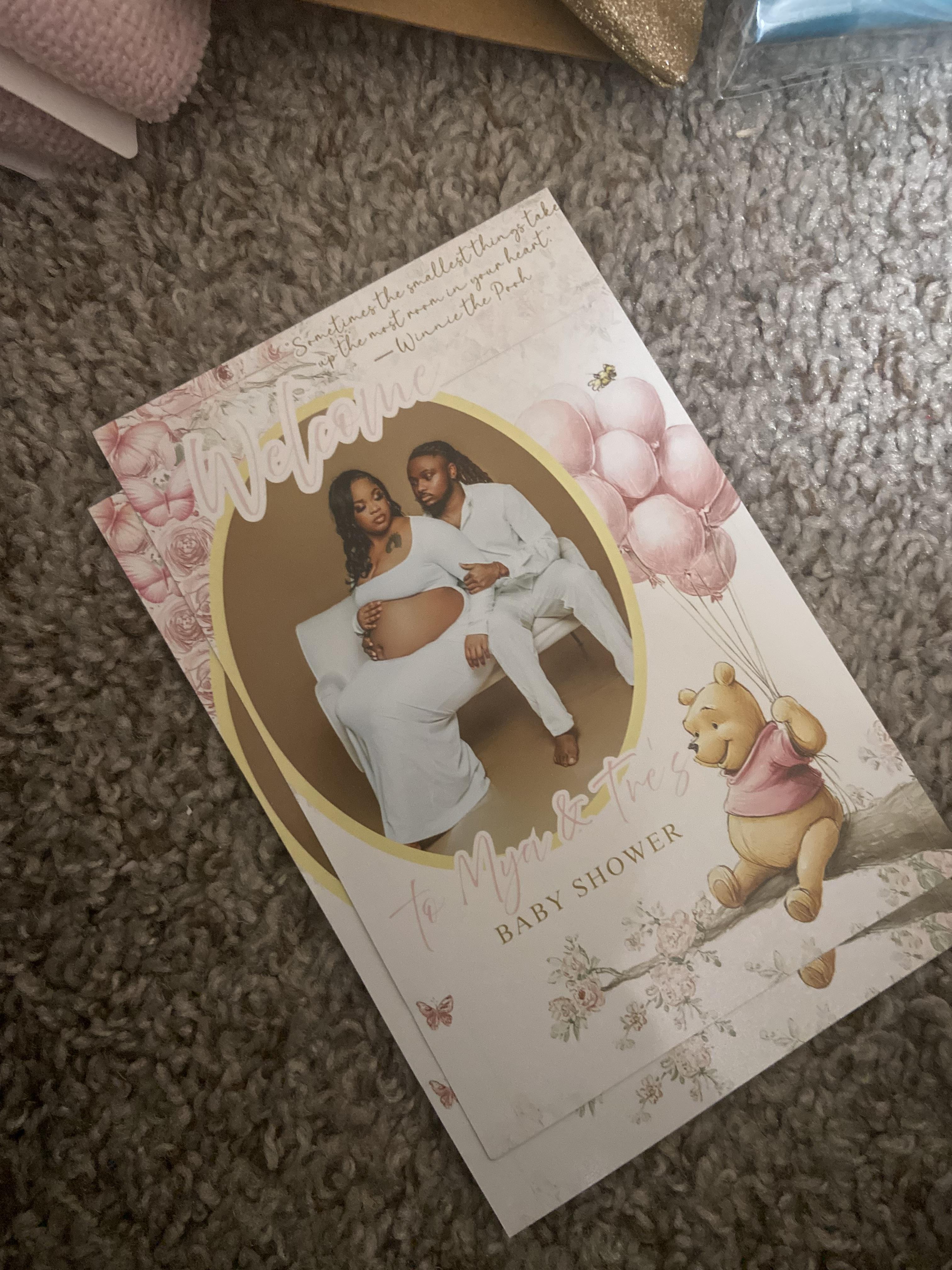A baby shower invitation on carpet