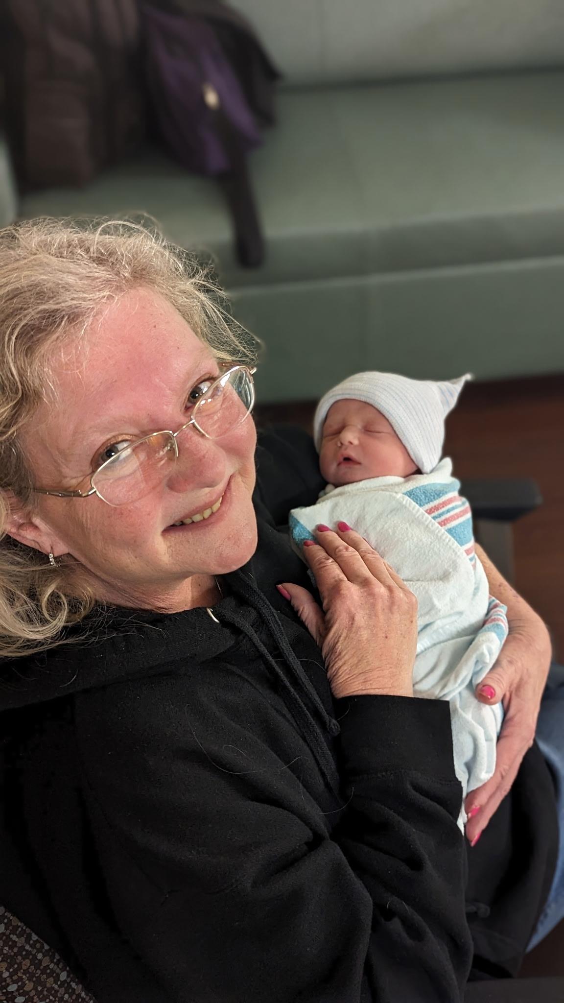 A woman holding a baby