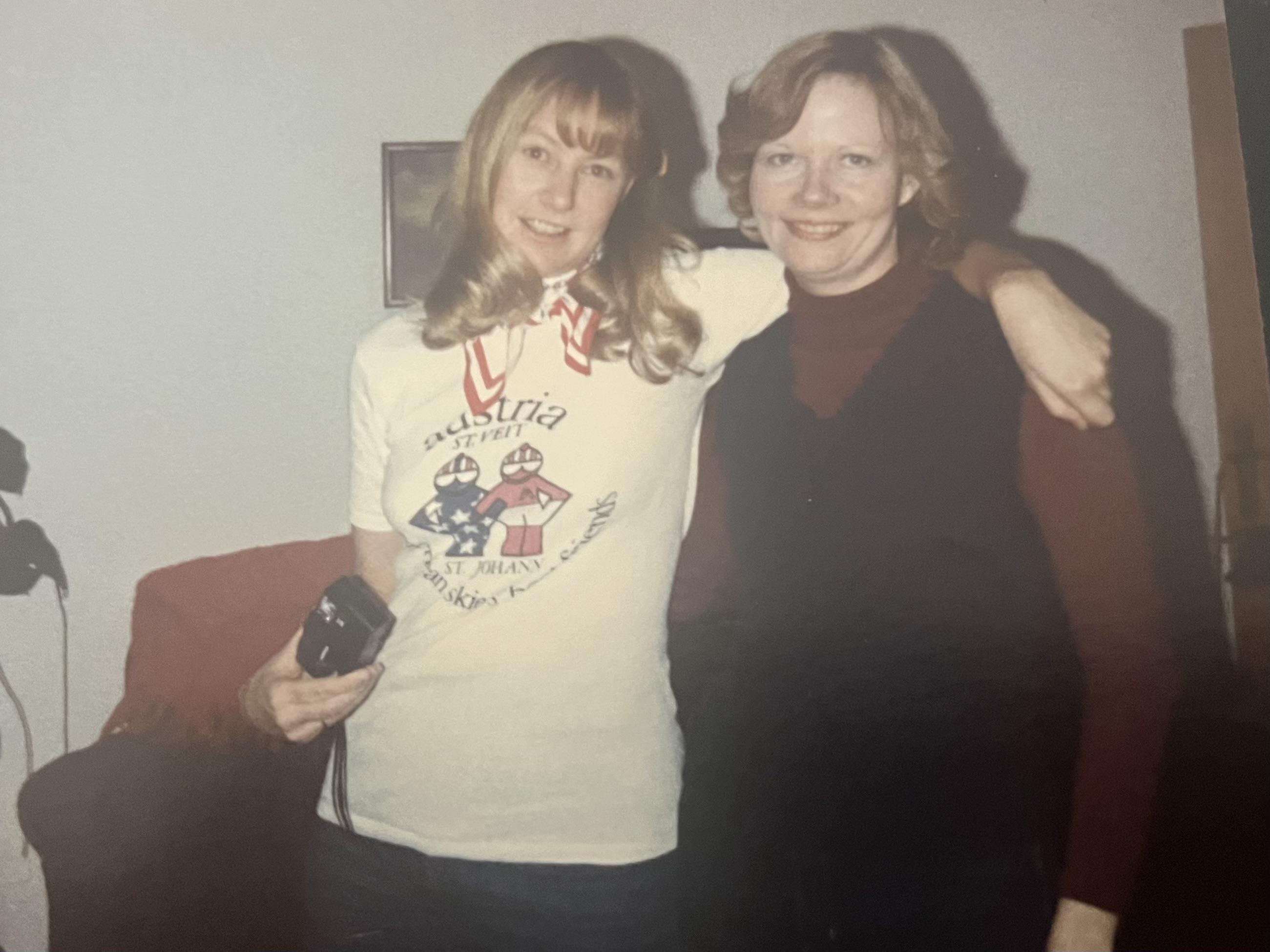 A couple of women posing for a picture