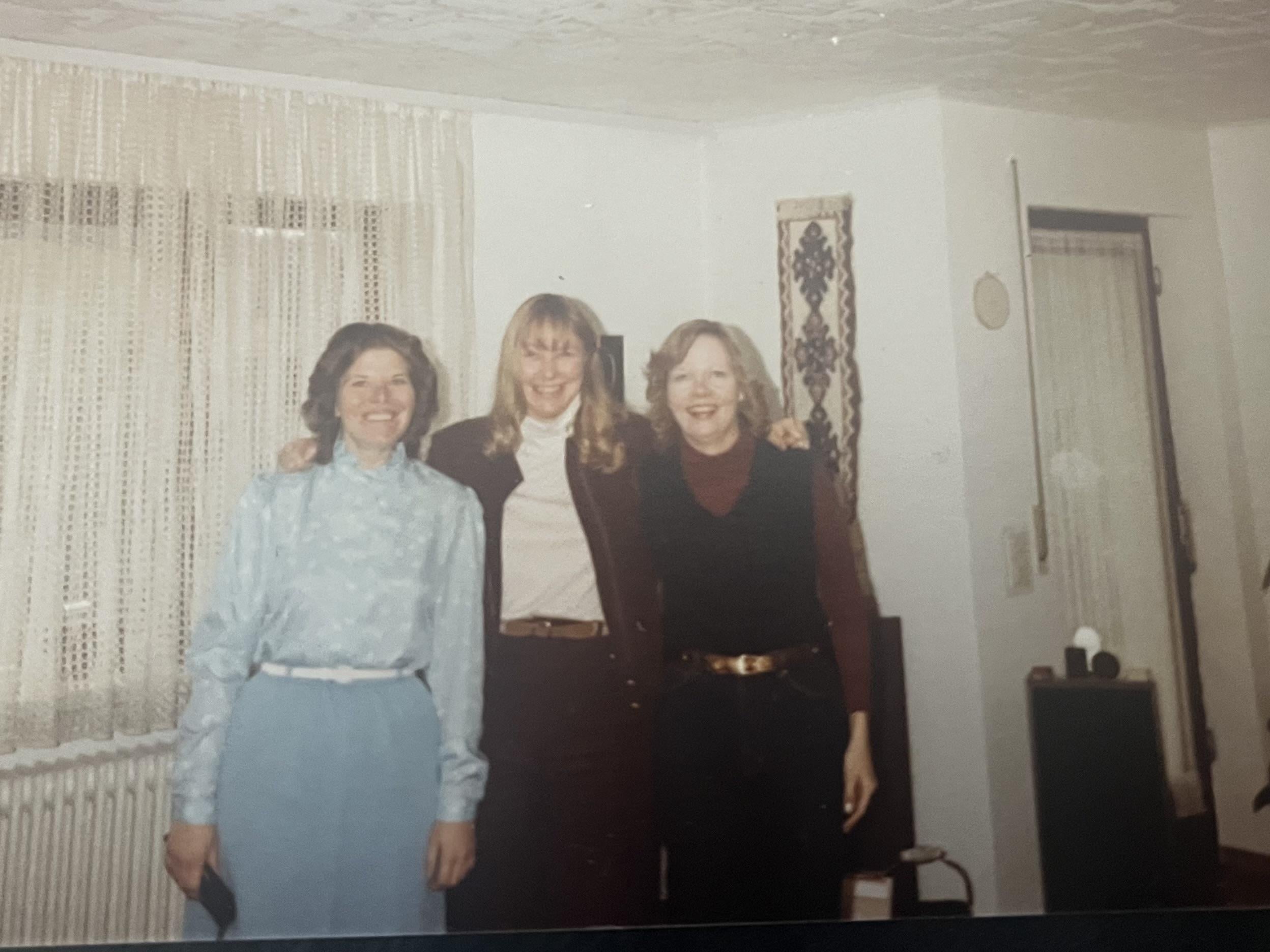 A group of women standing in a room