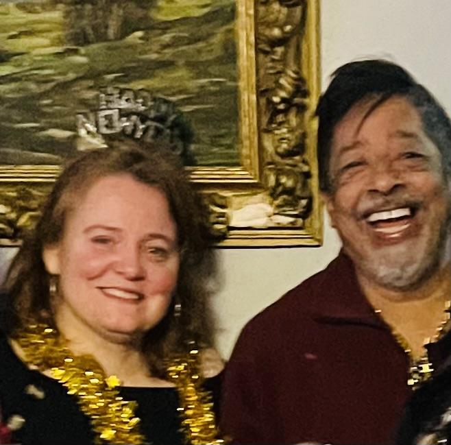 A man and woman smiling for a picture