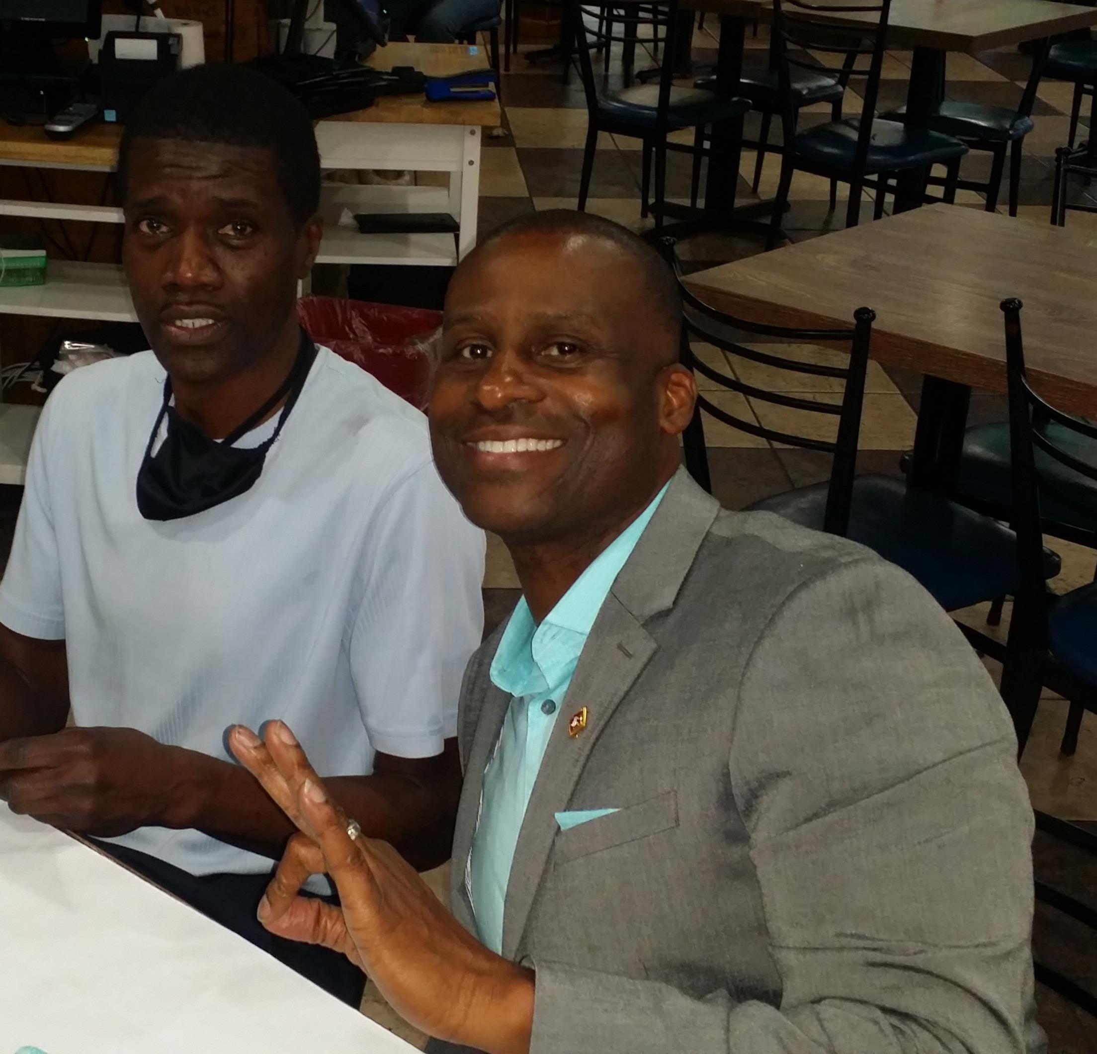 A couple of men sitting at a table