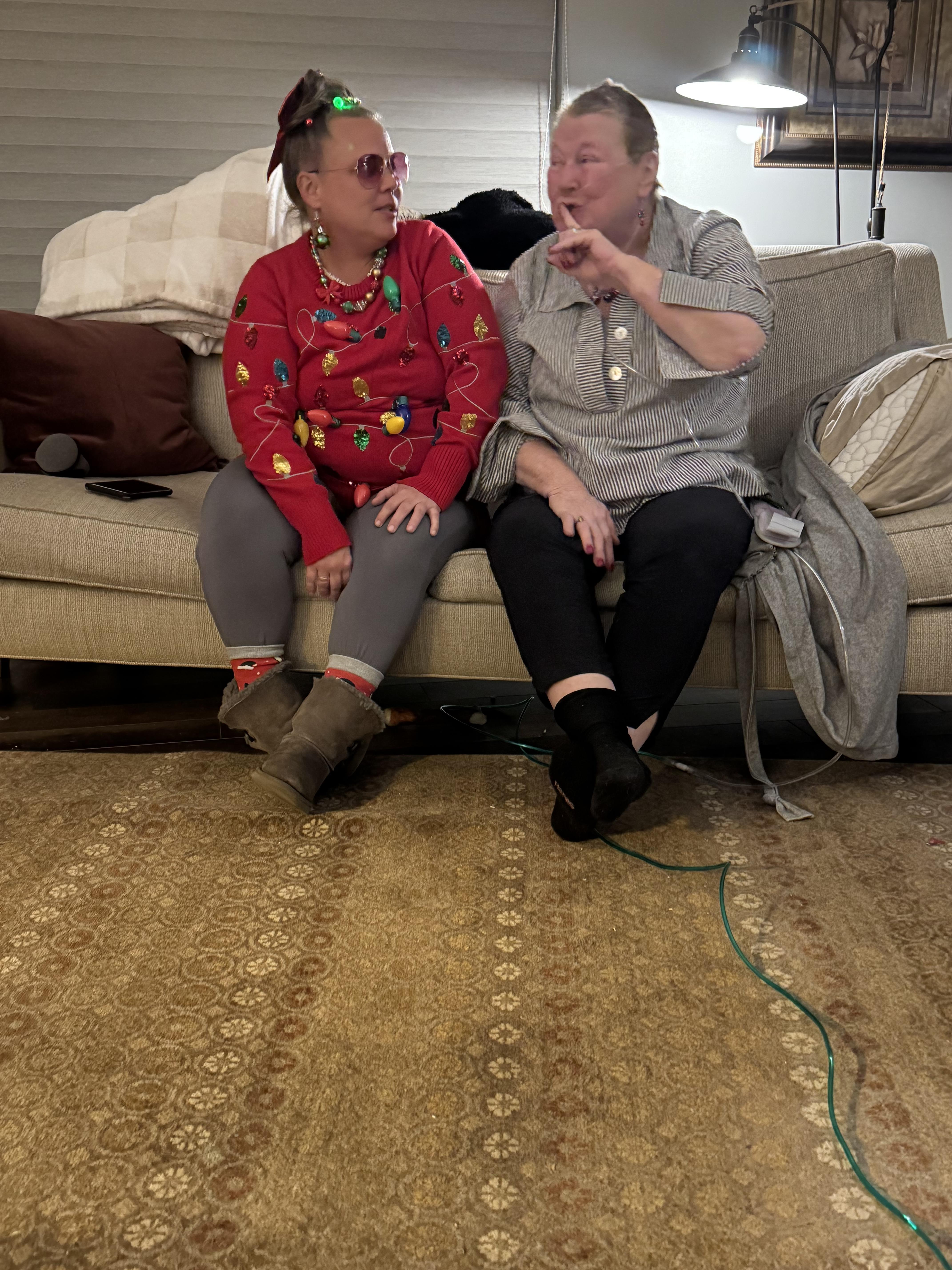 Two women sitting on a couch