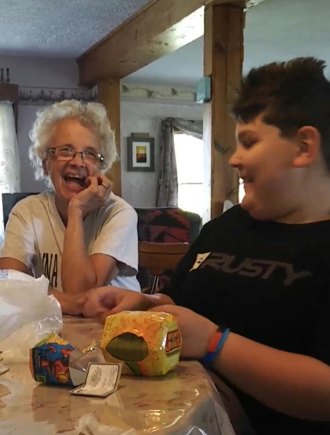 A woman and boy sitting at a table