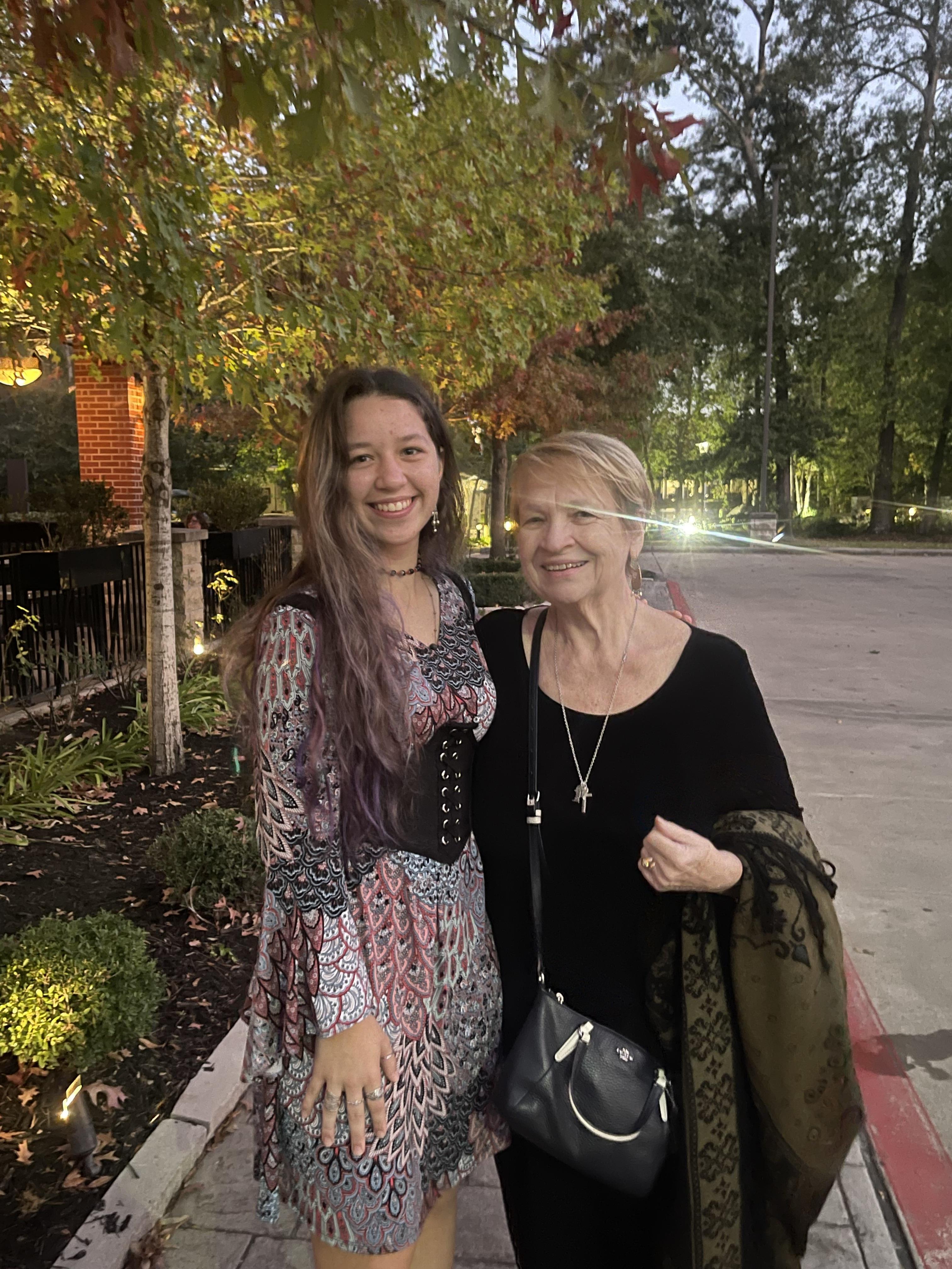 Two women standing together smiling
