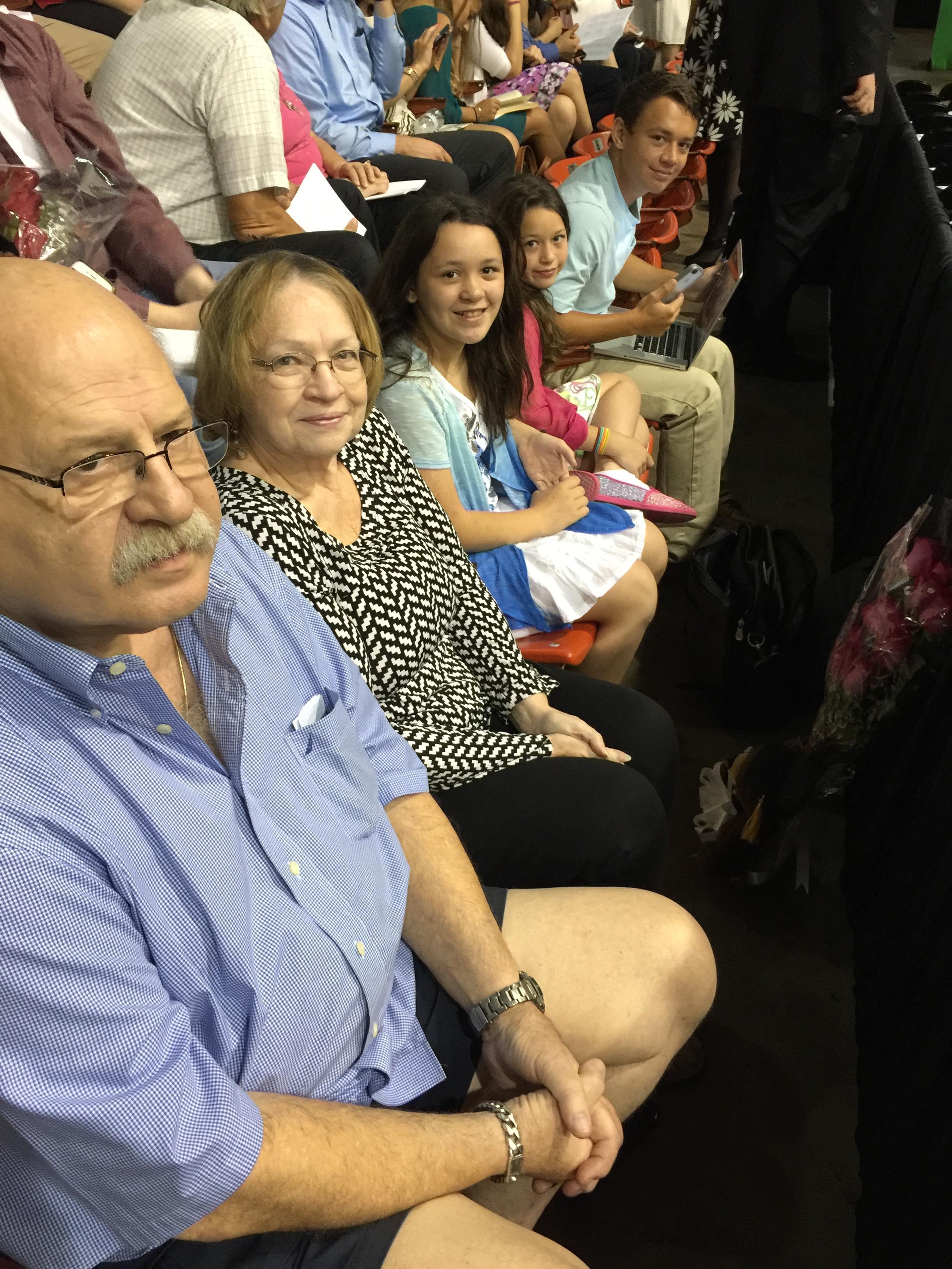 A group of people sitting in a row