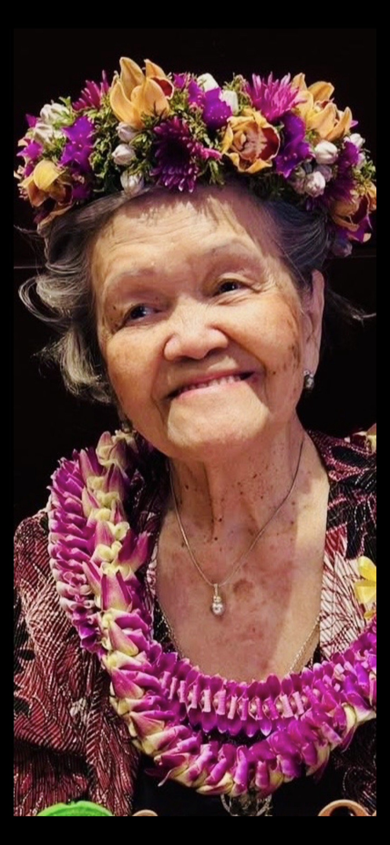 A woman with a flower necklace