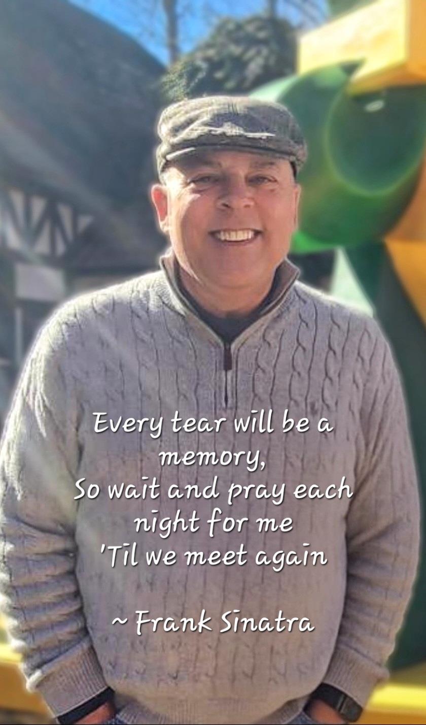 A man wearing a hat and sweater