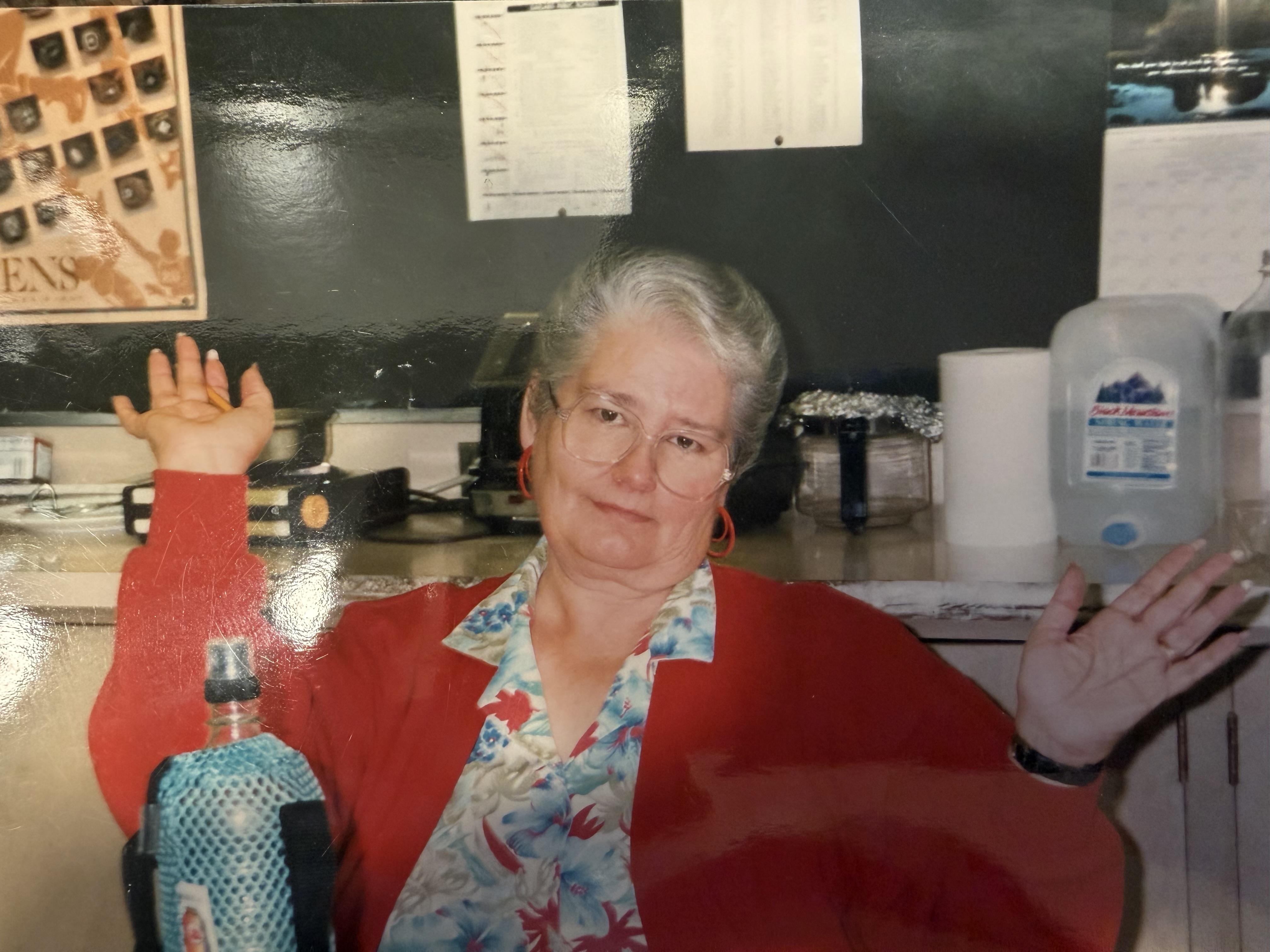 A woman holding a bottle of water