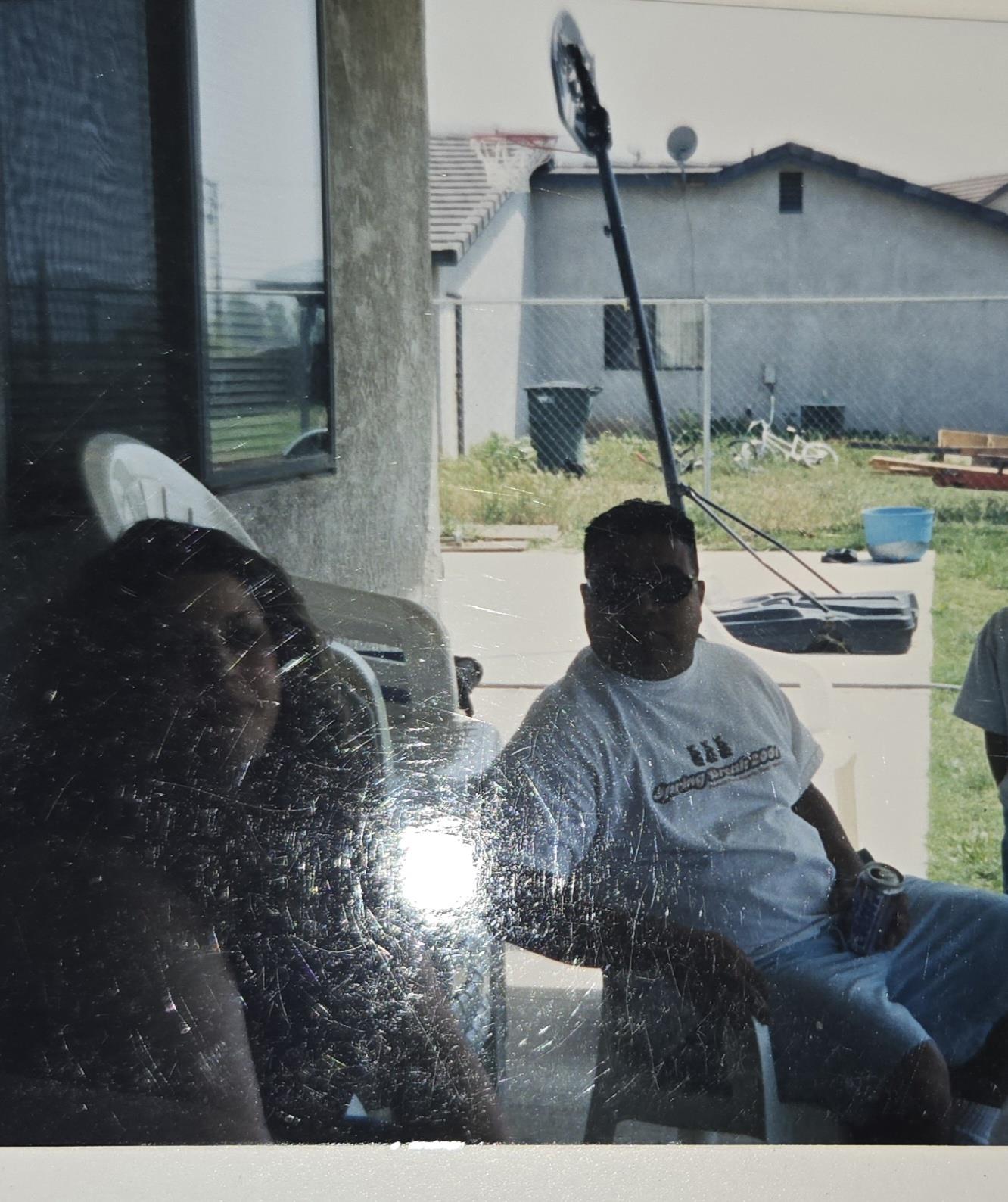 A man and woman sitting in a chair