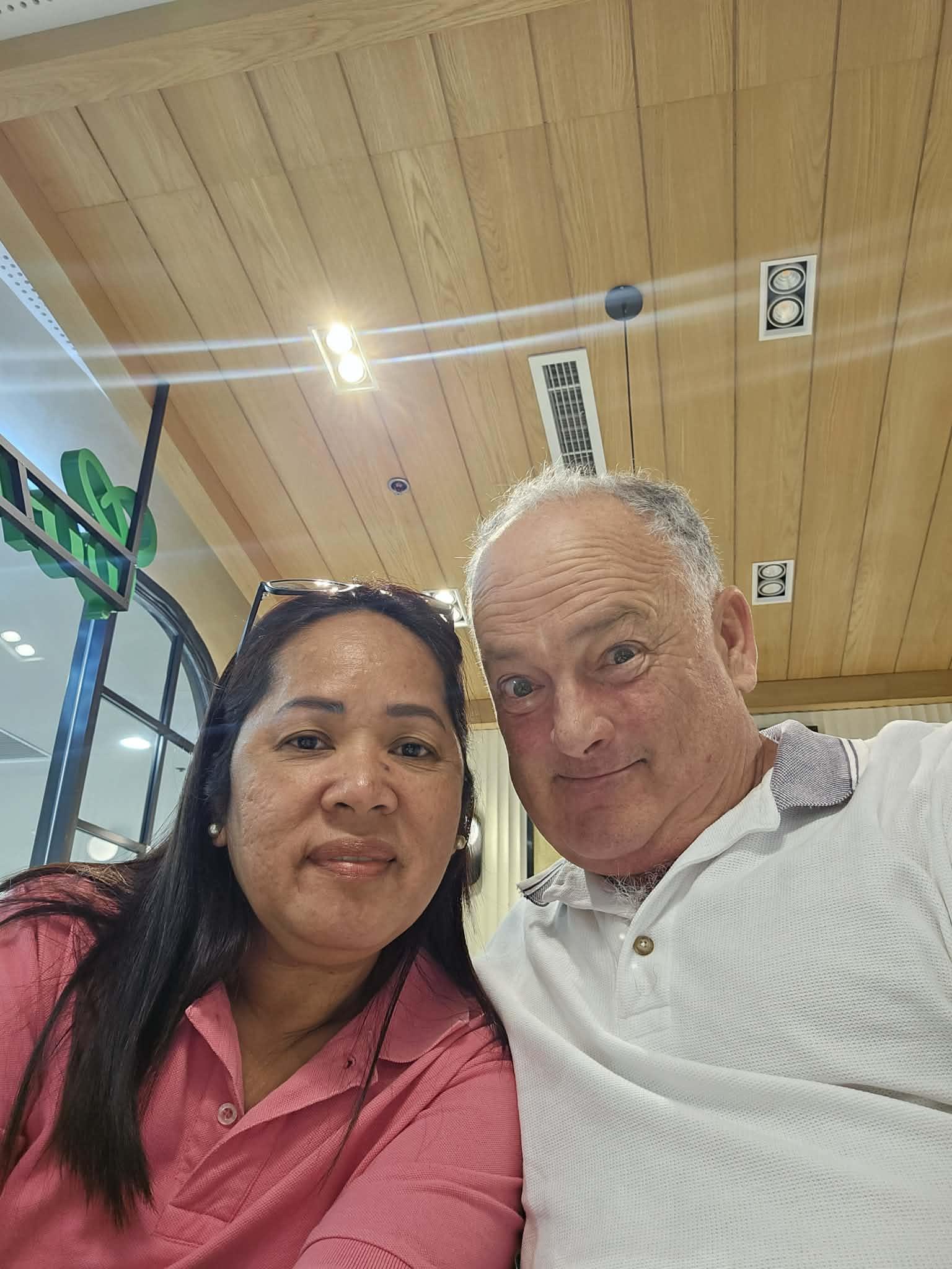 A man and woman taking a selfie