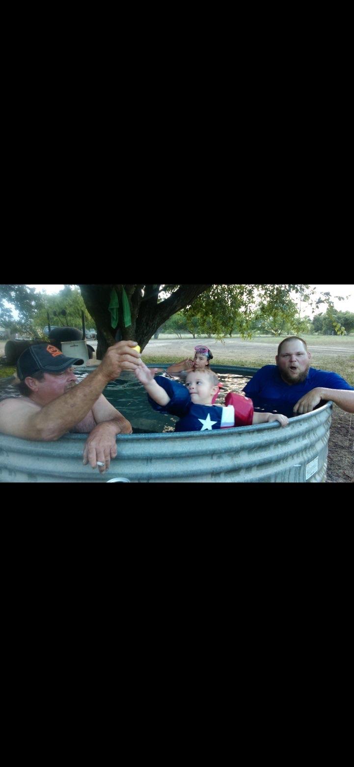 A group of people in a metal tub
