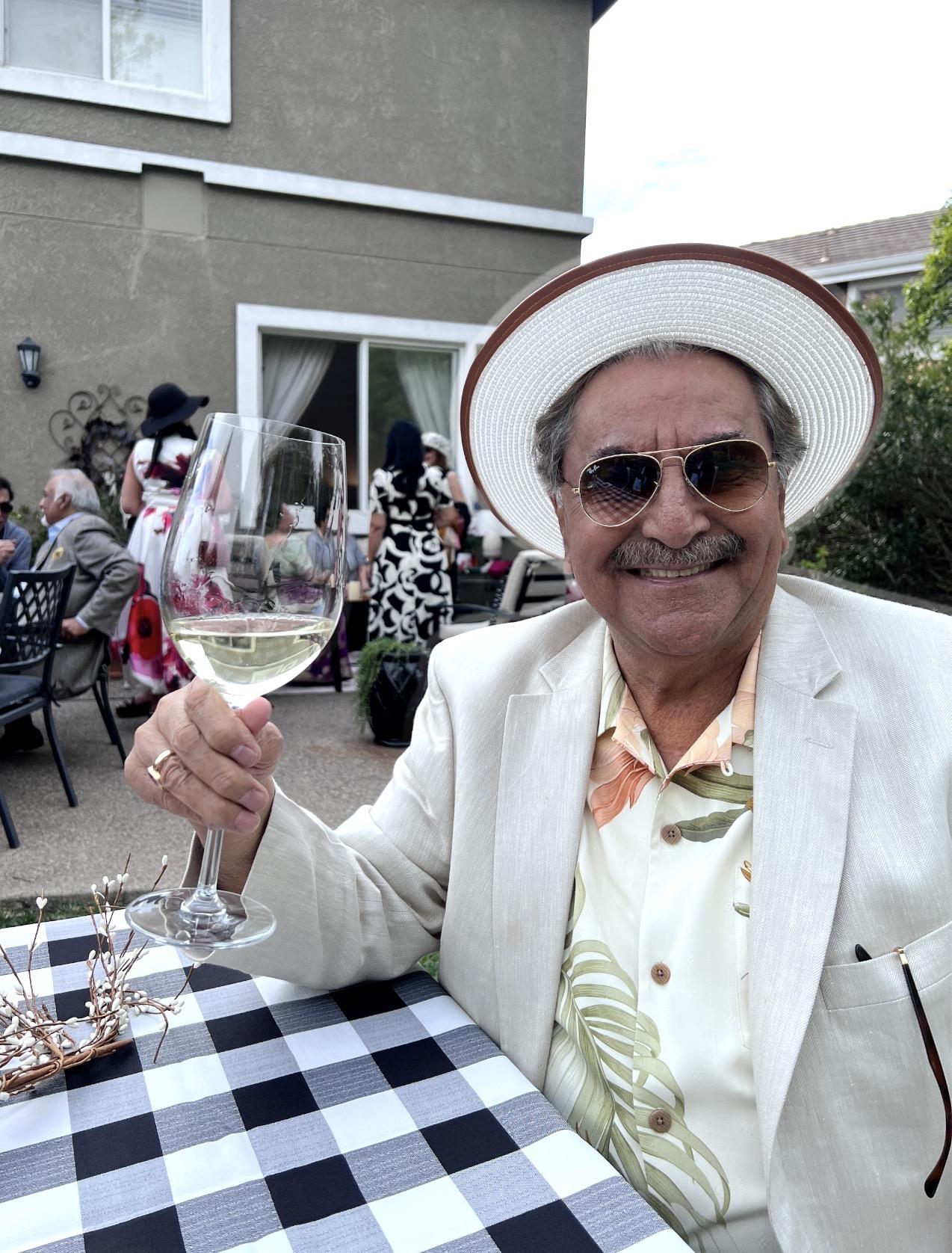 A man holding a wine glass