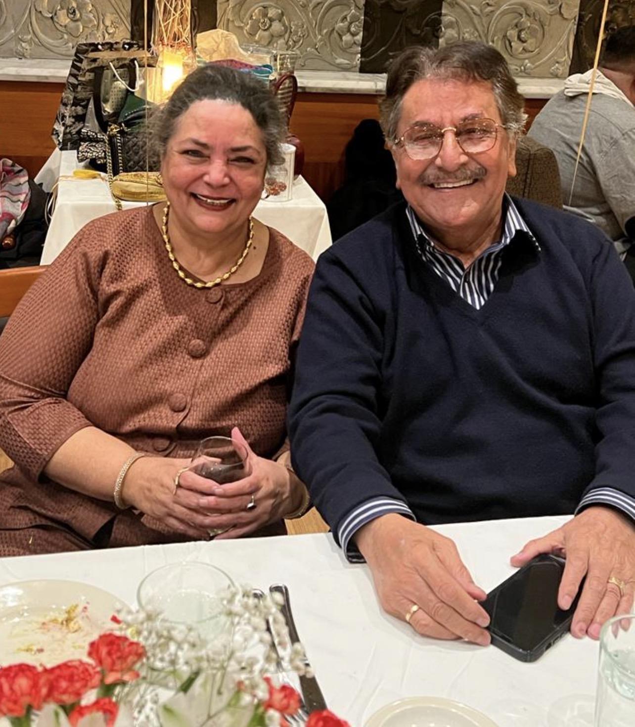 A man and woman sitting at a table