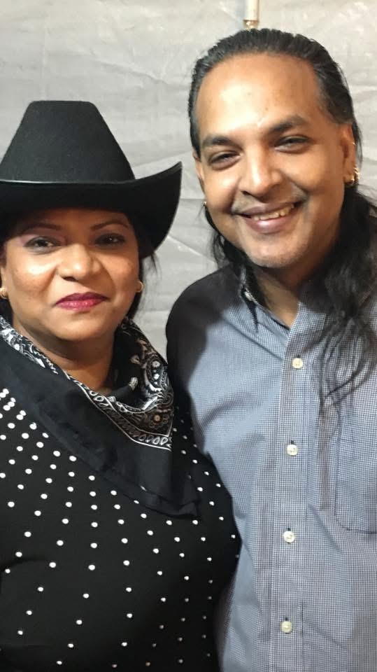 A man and woman smiling for a picture