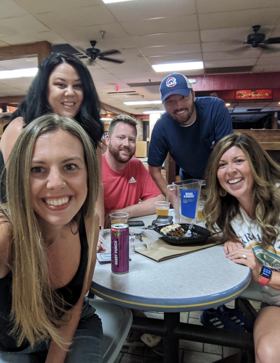 A group of people sitting at a table