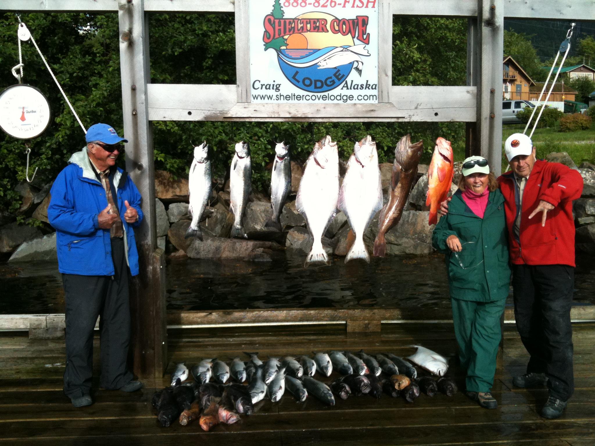 A group of people standing next to a sign