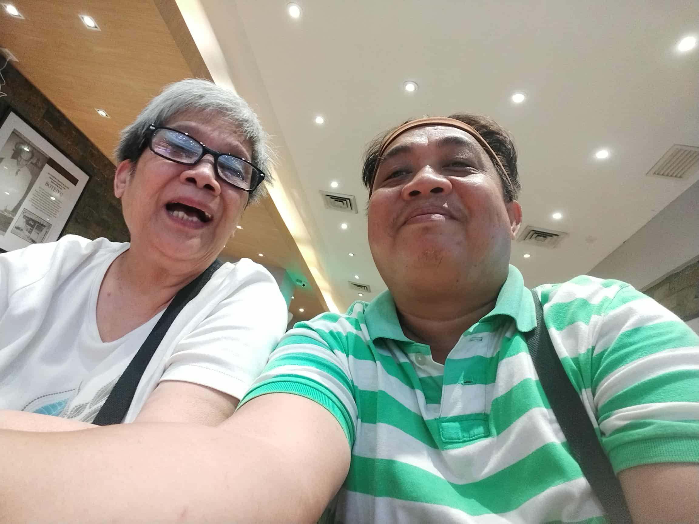 A man and woman taking a selfie