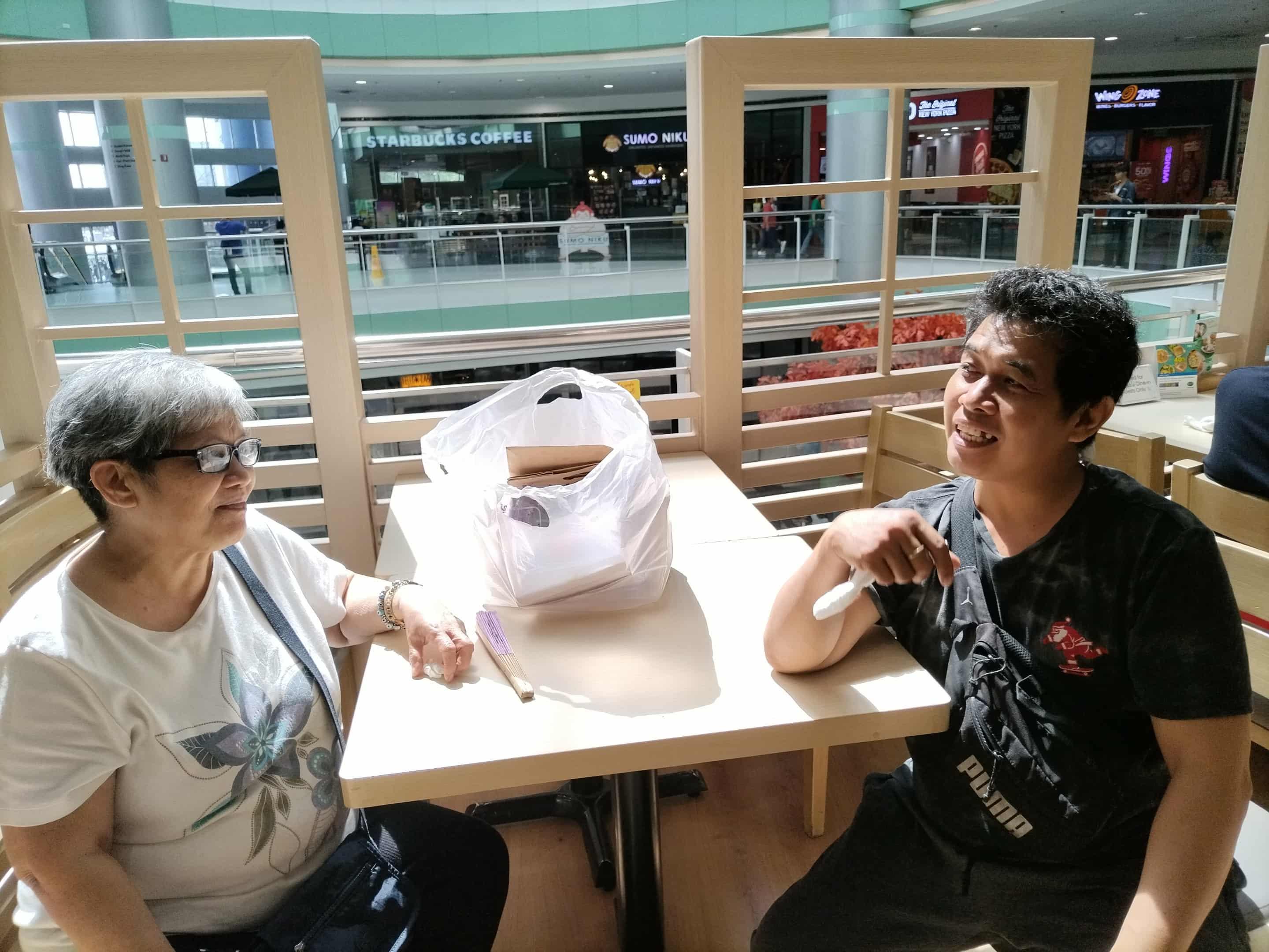 A man and woman sitting at a table