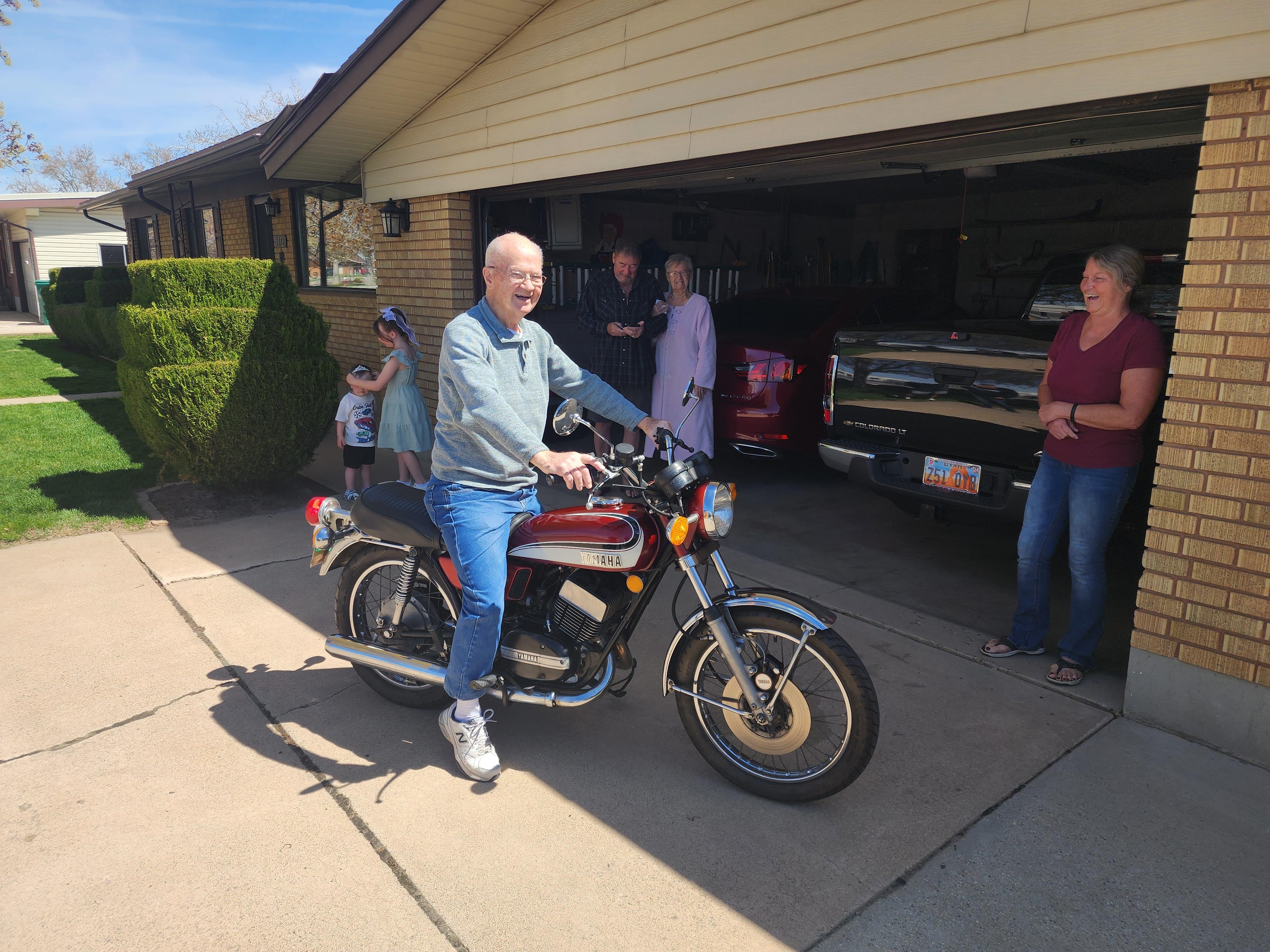 A man sitting on a motorcycle