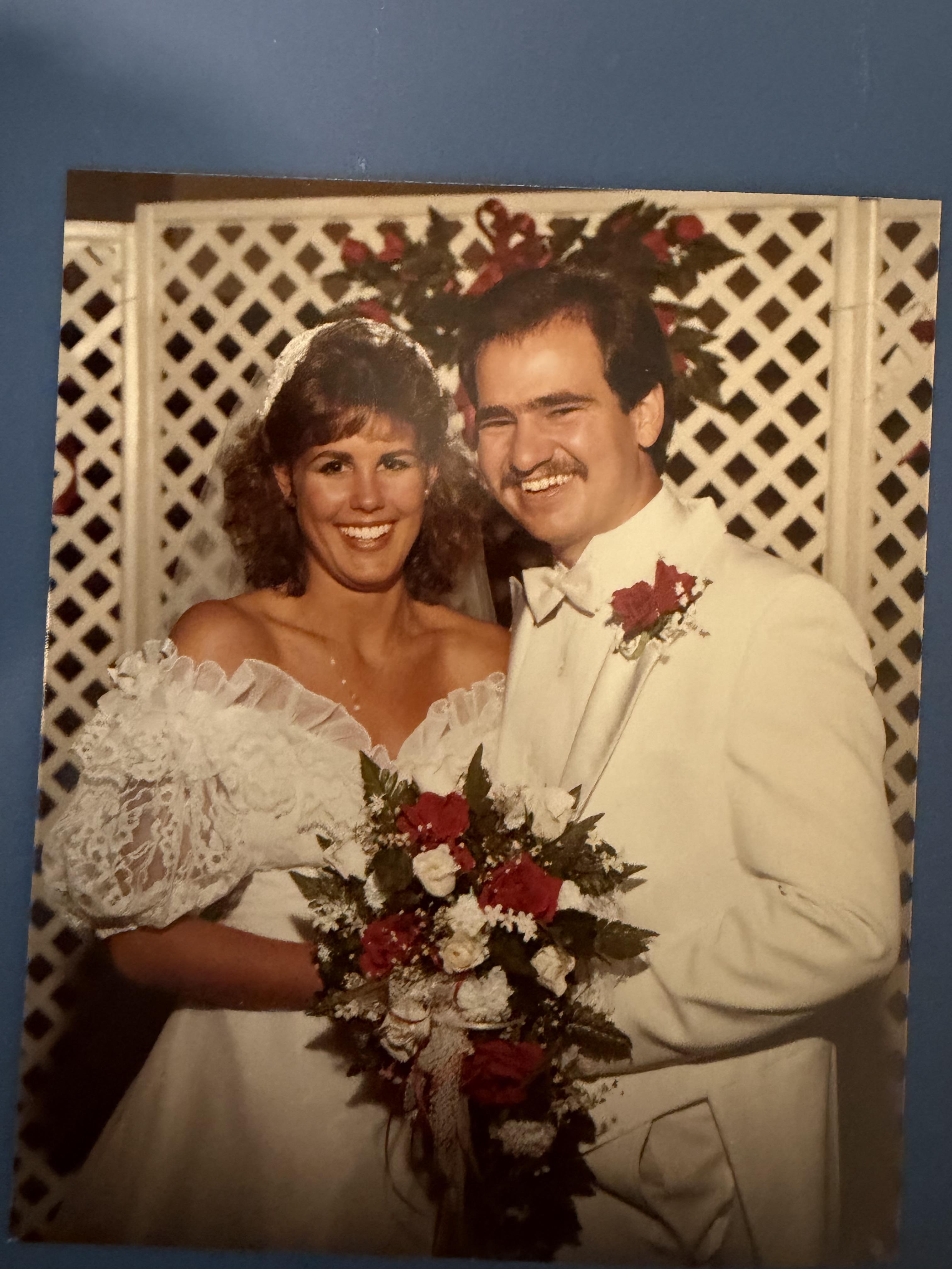 A man and woman posing for a picture