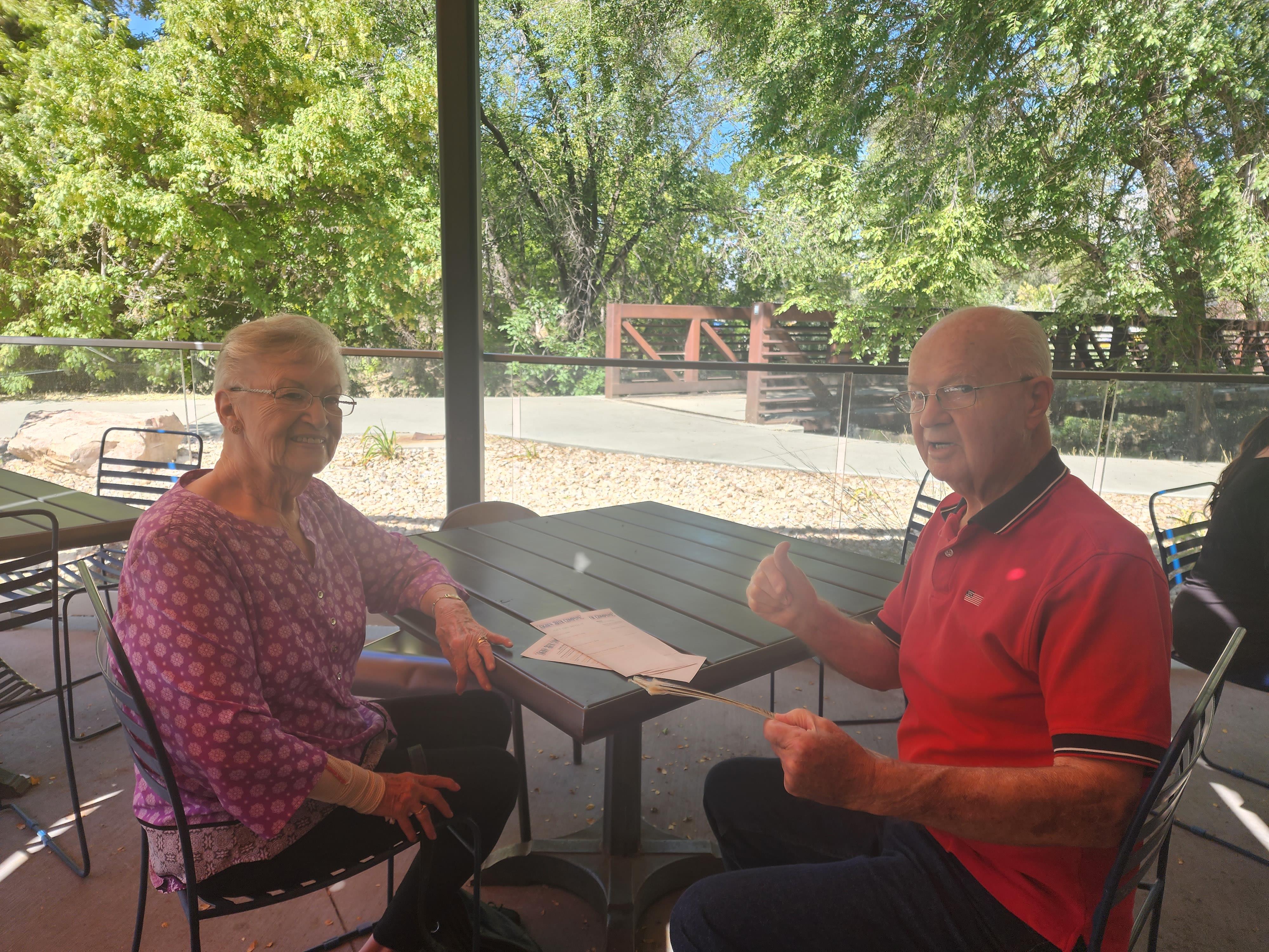 A man and woman sitting at a table