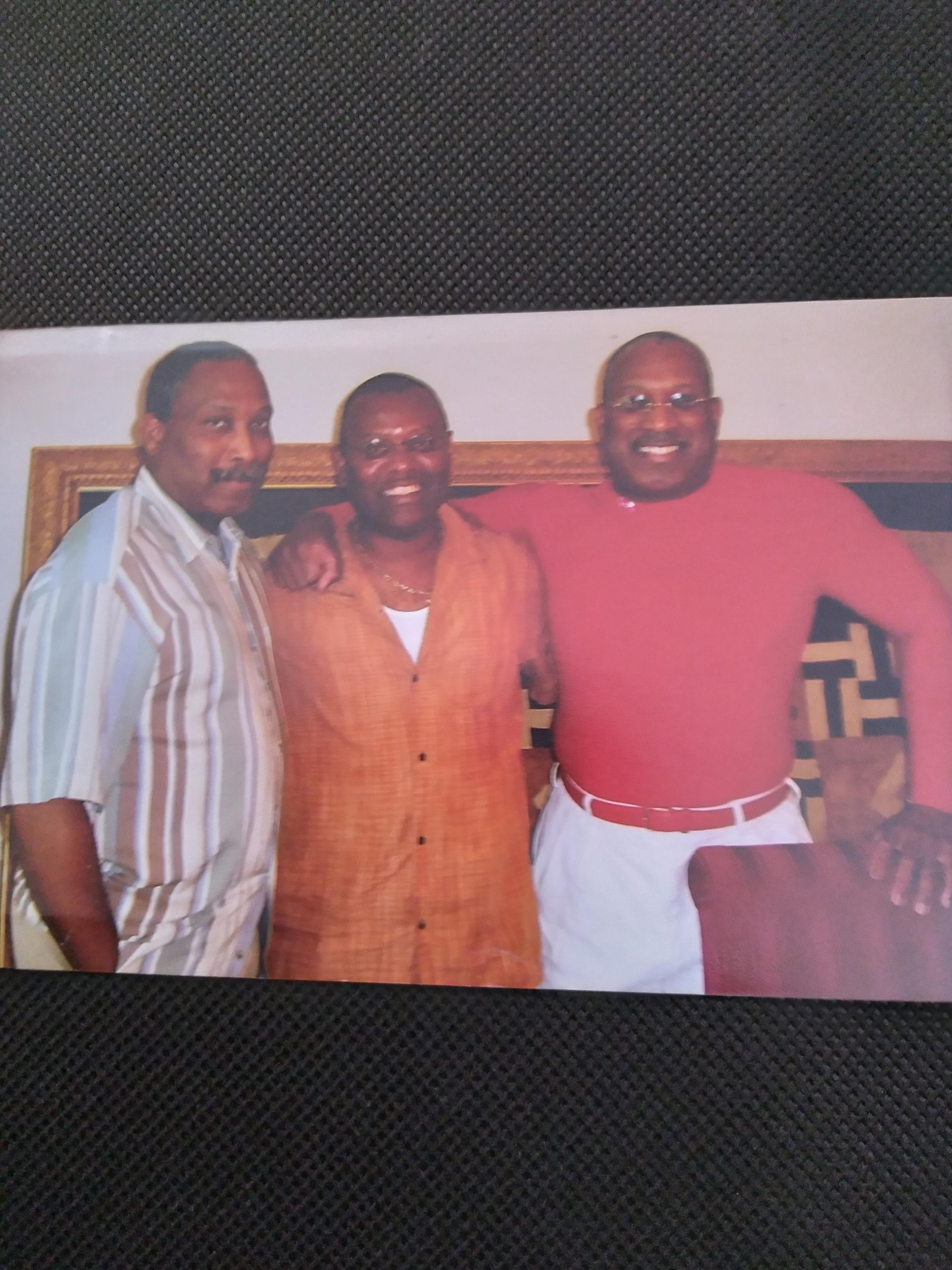 A group of men posing for a picture