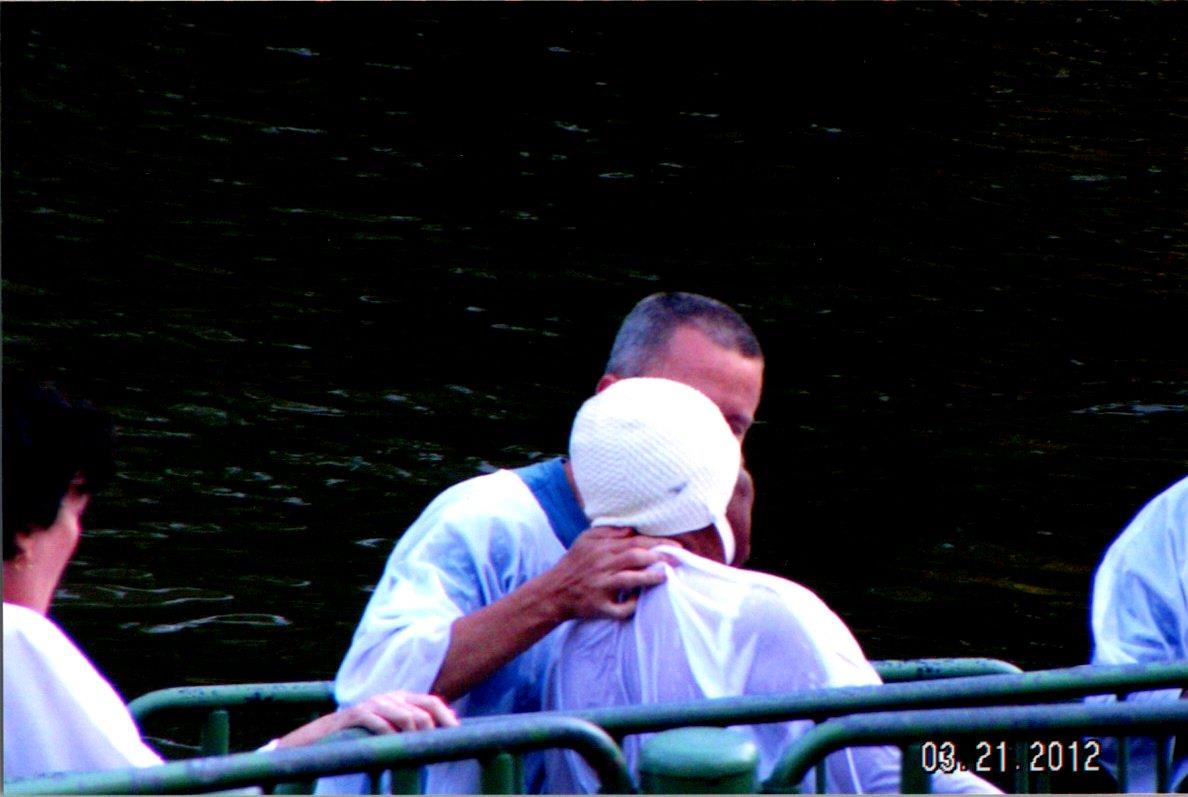 A man hugging another man