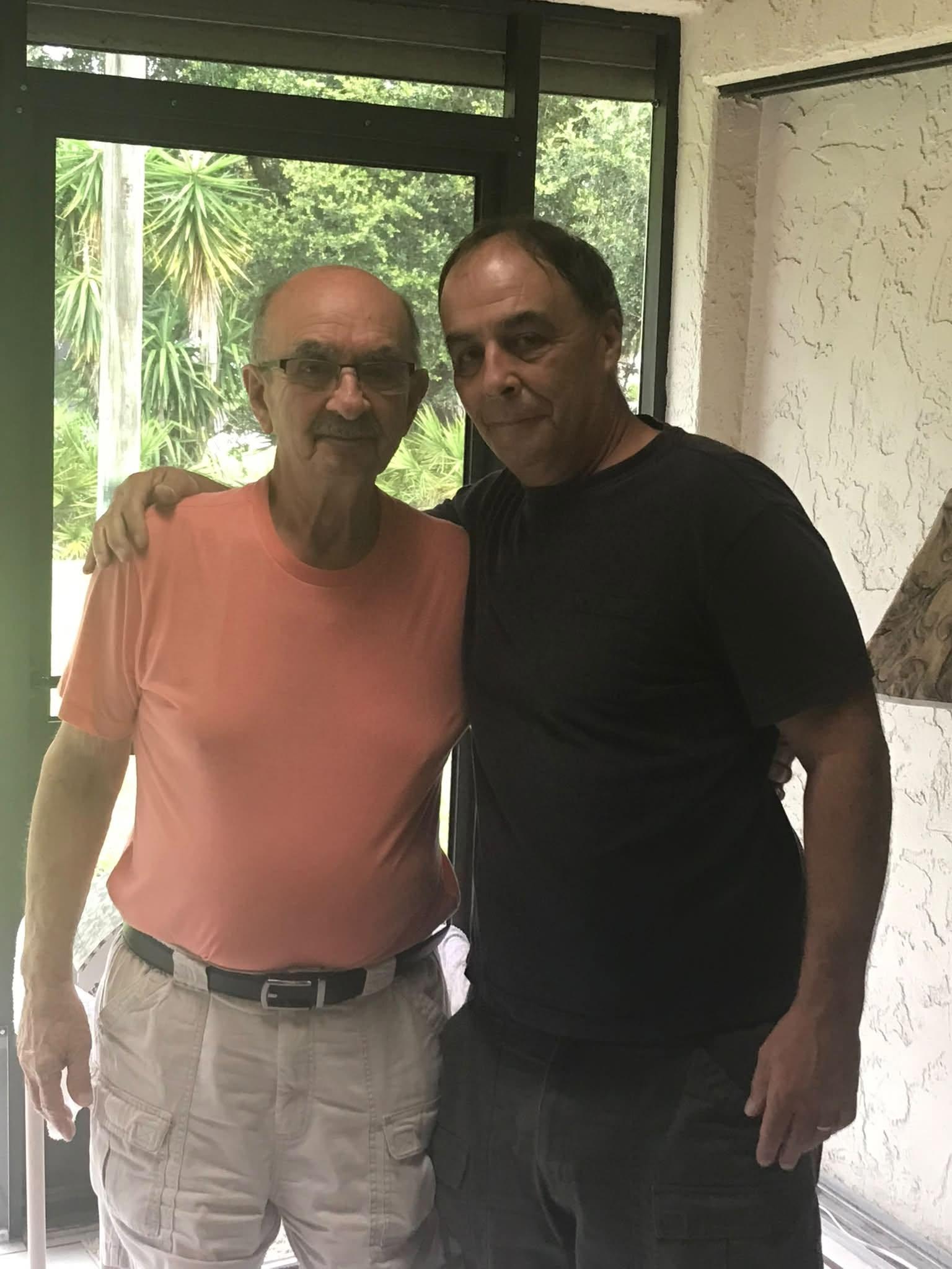 Two men standing next to each other