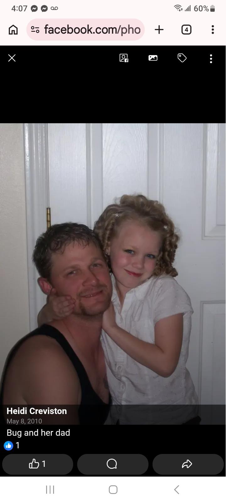 A man and a girl posing for a picture