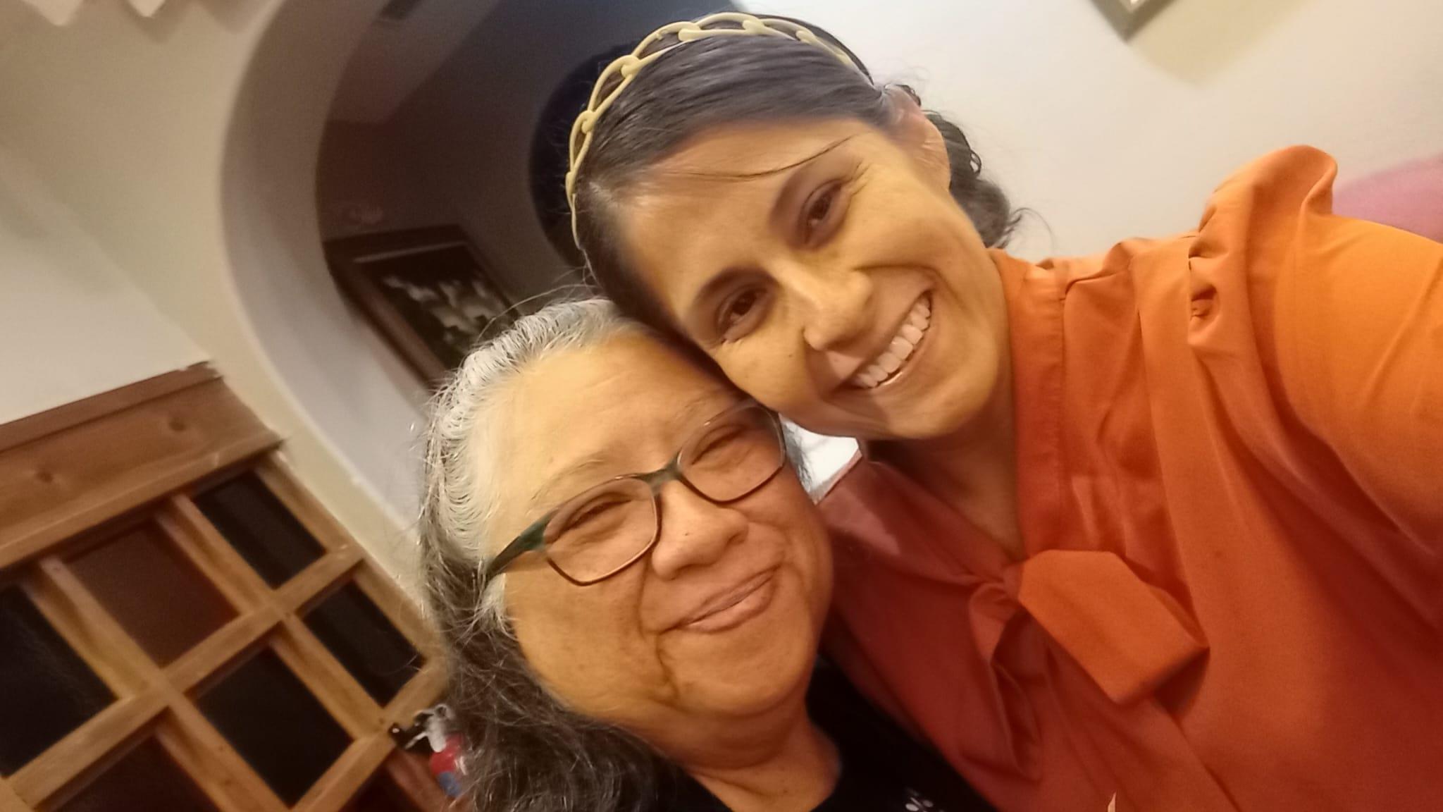 A woman and a woman smiling