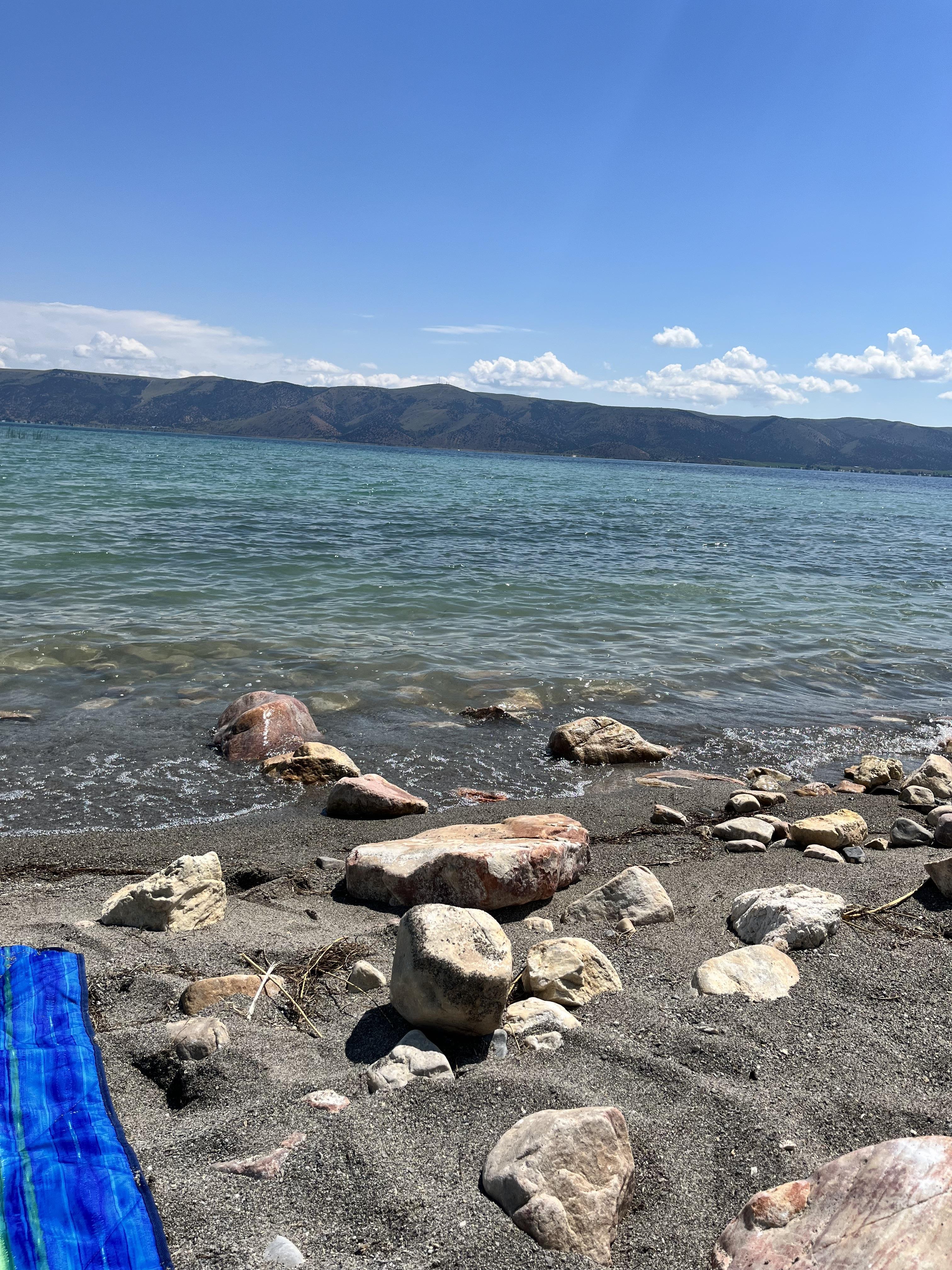 A beach with rocks and water