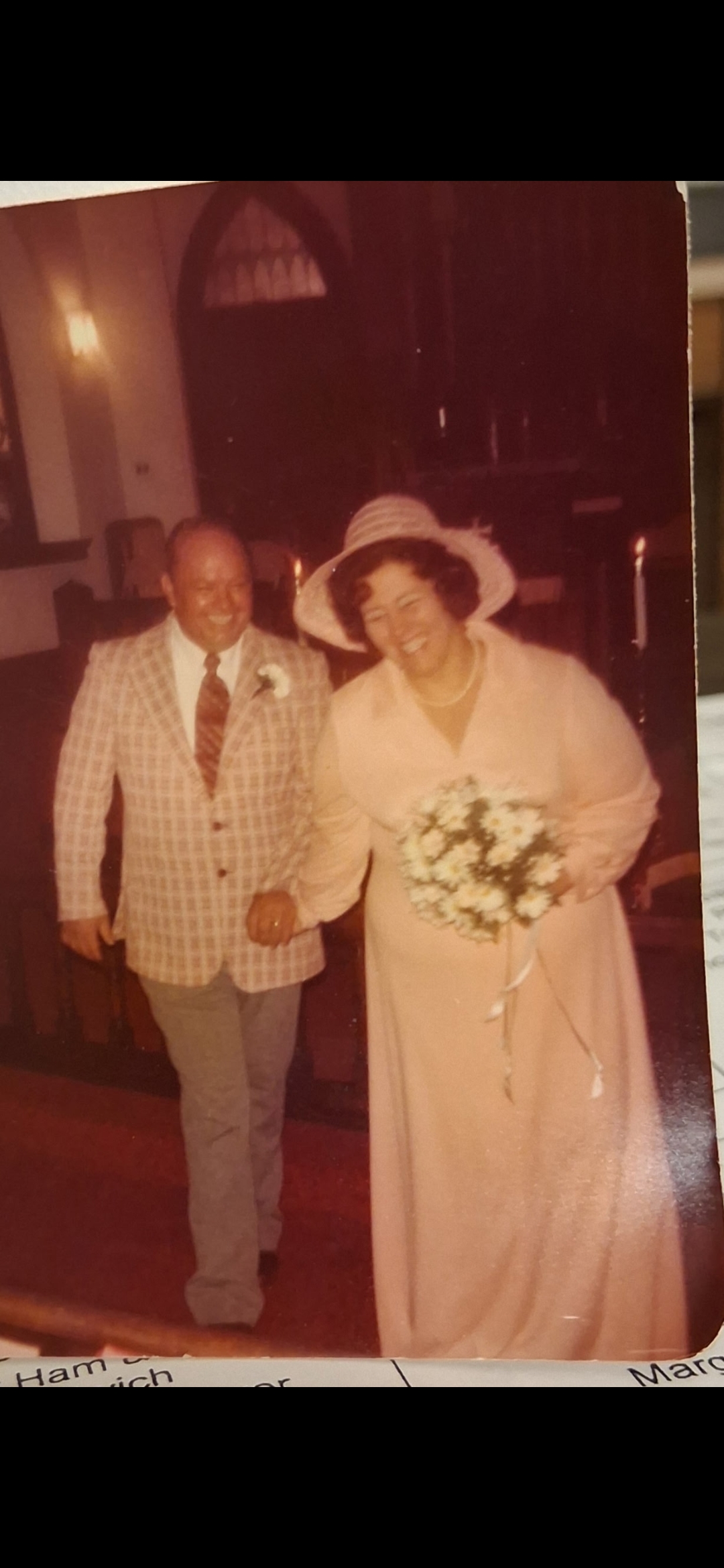 A man and woman holding hands and walking