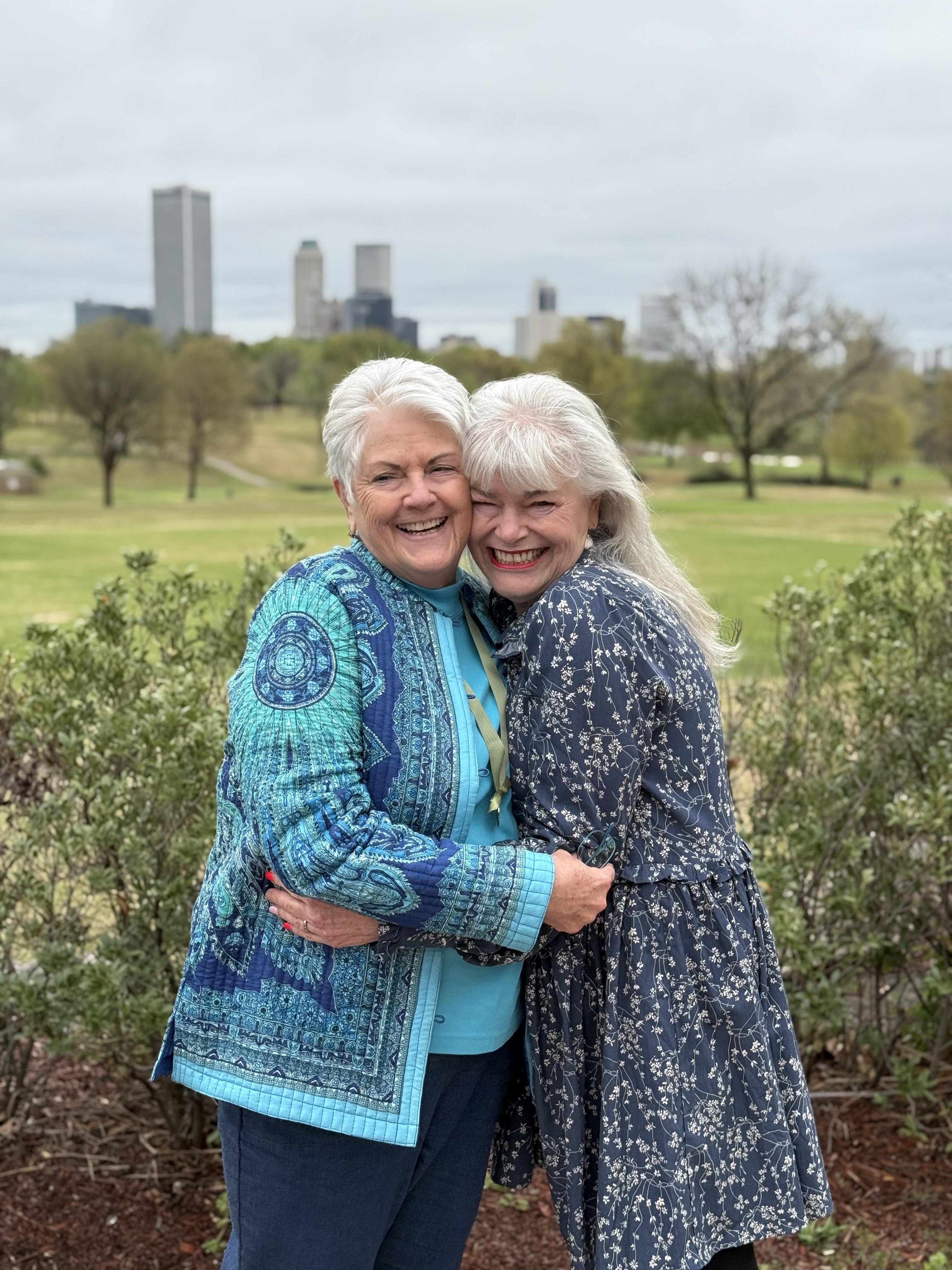 Two women hugging each other