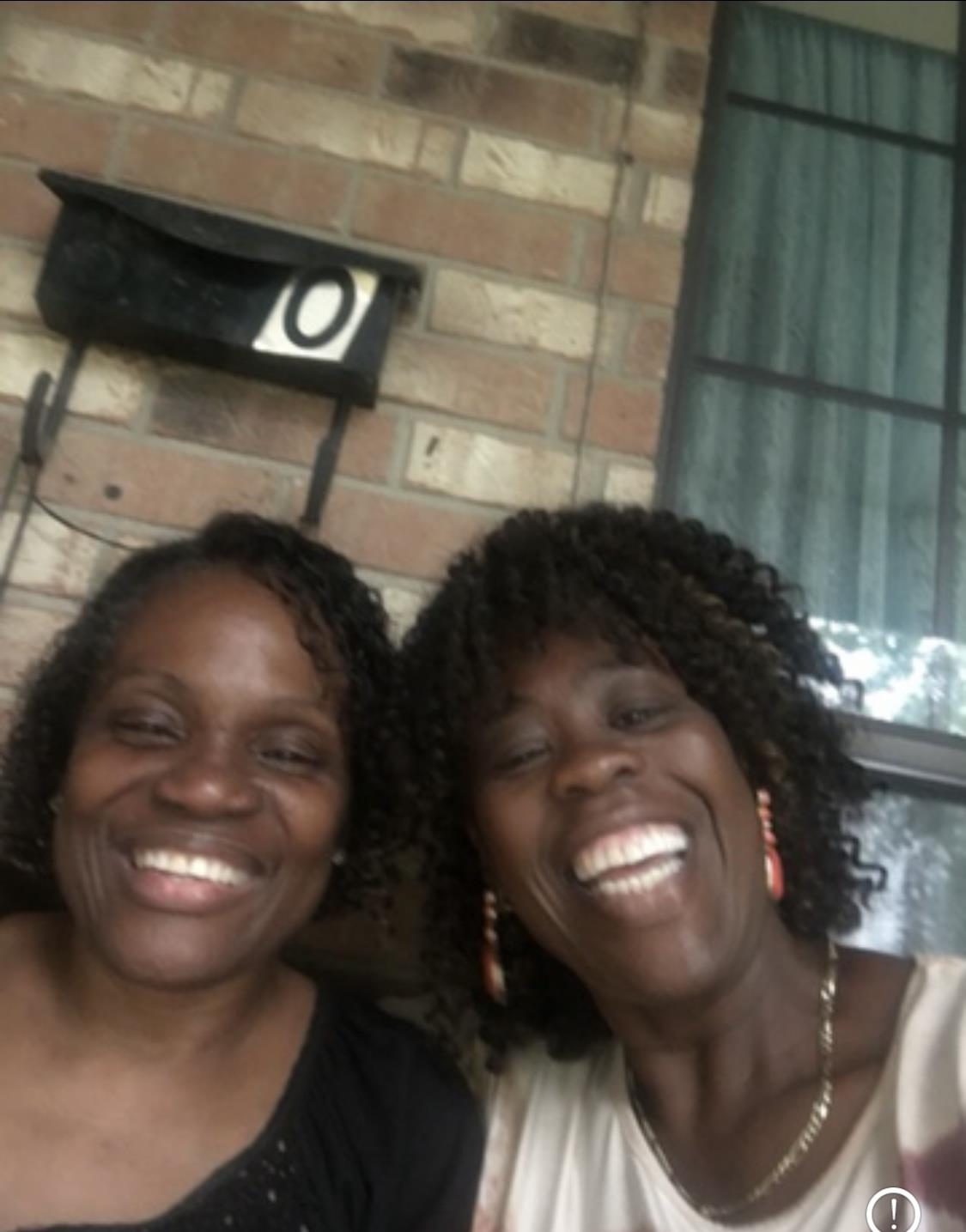 Two women smiling at the camera