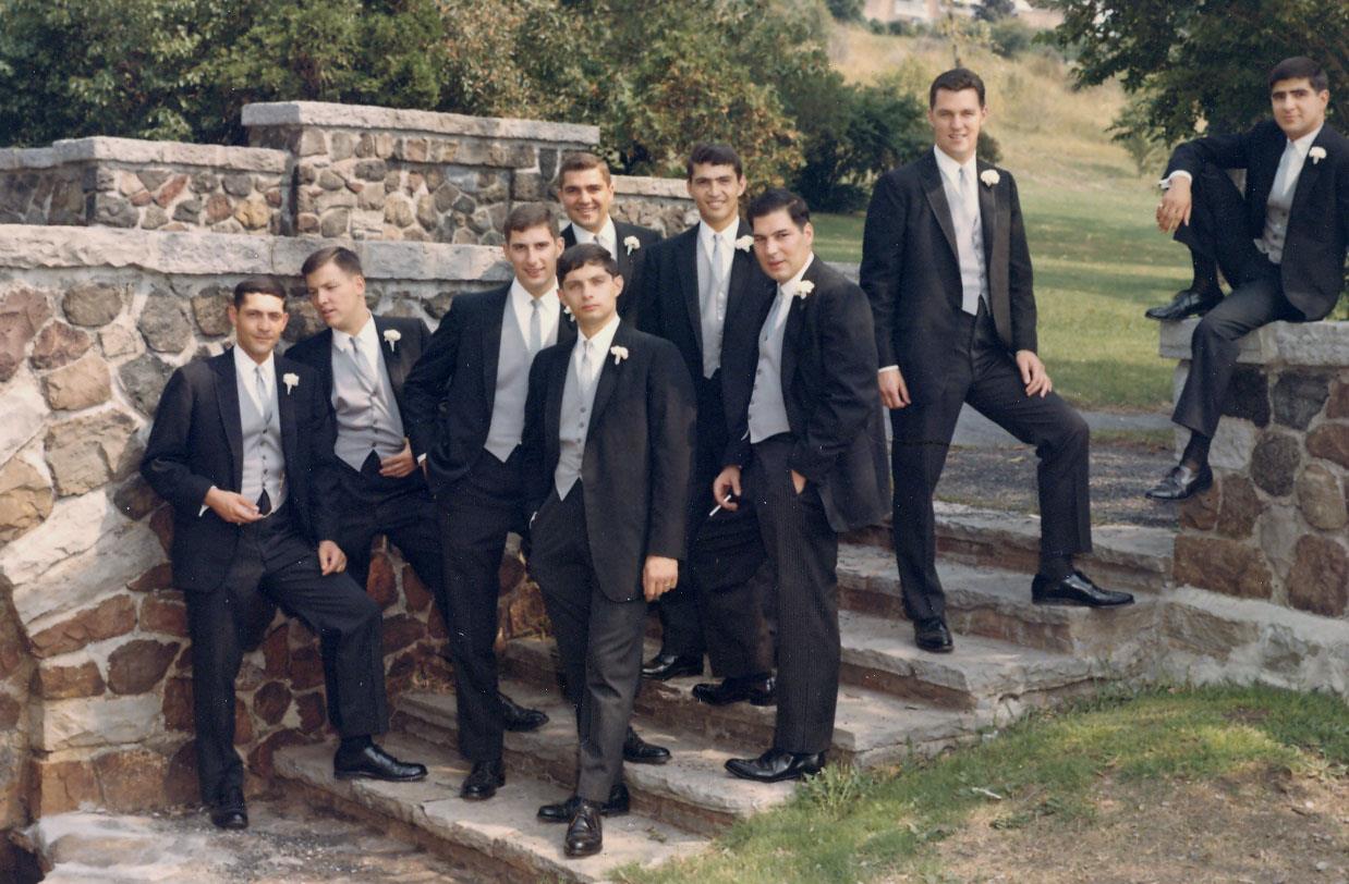 A group of men in suits posing for a photo