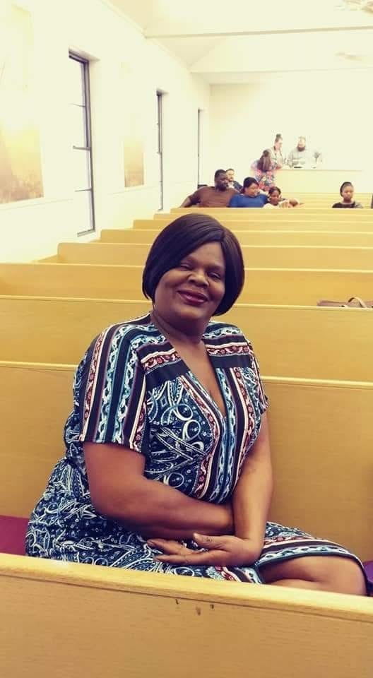 A woman sitting in a classroom