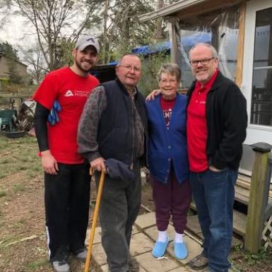 A group of people standing together outside