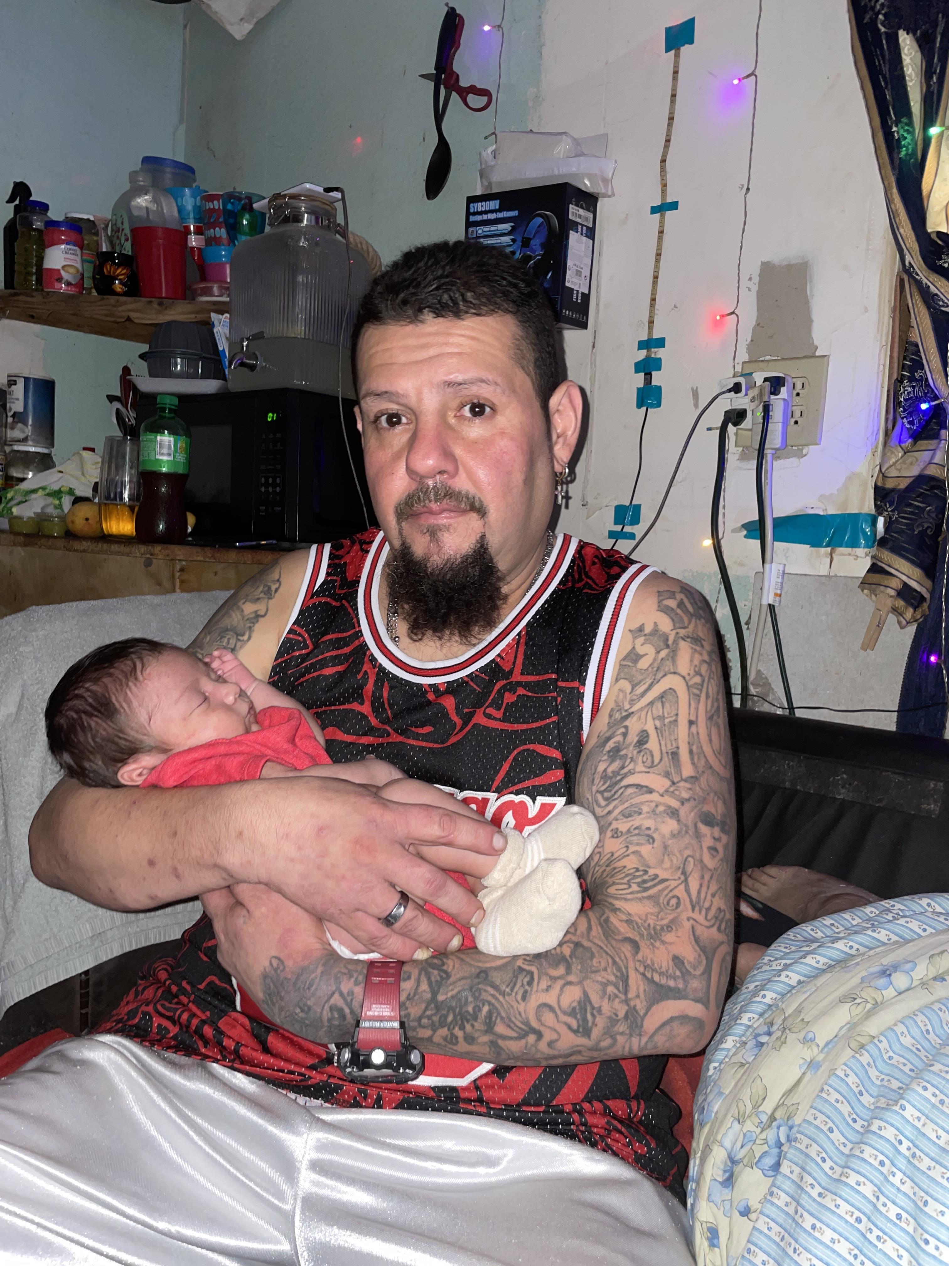 A man holding a baby