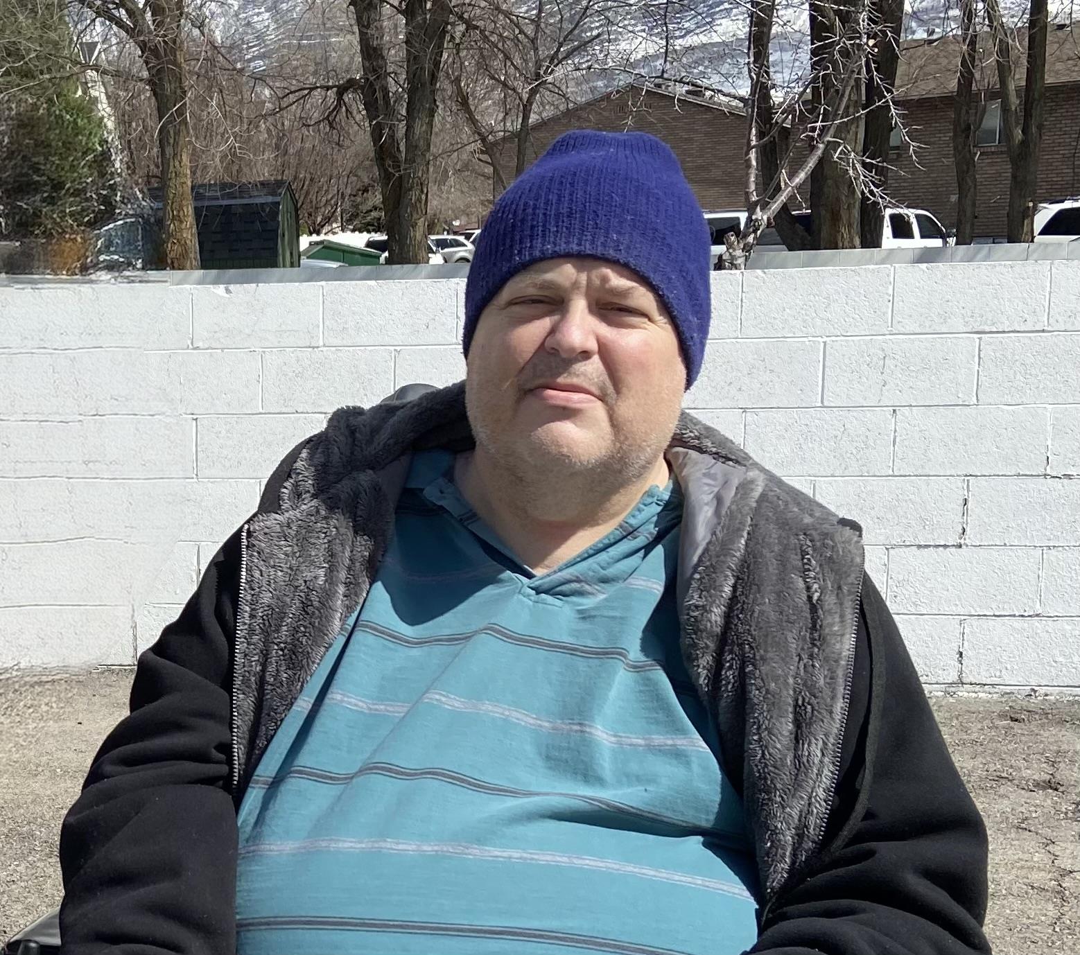 A man in a blue hat