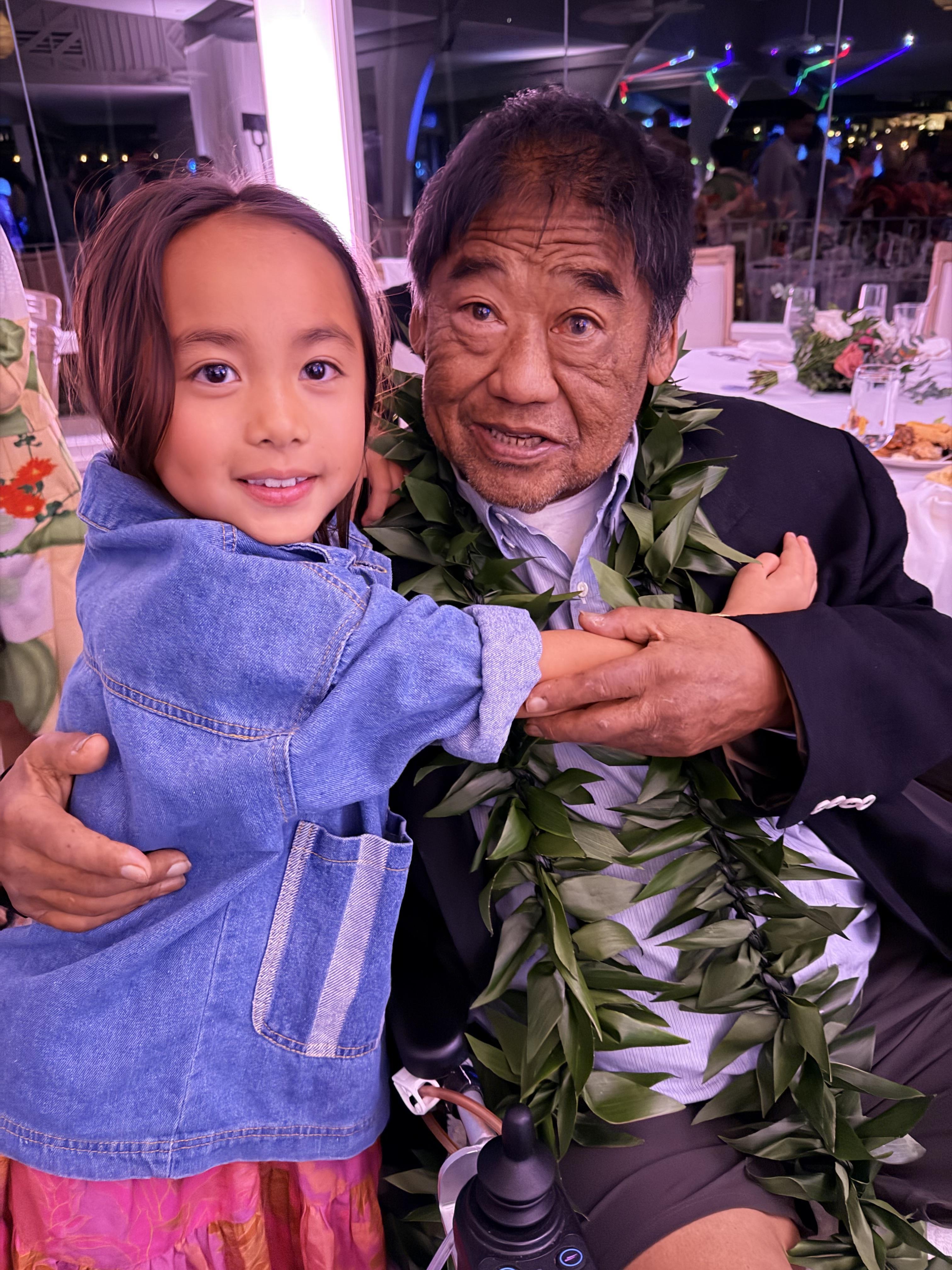 A man and a girl posing for a picture