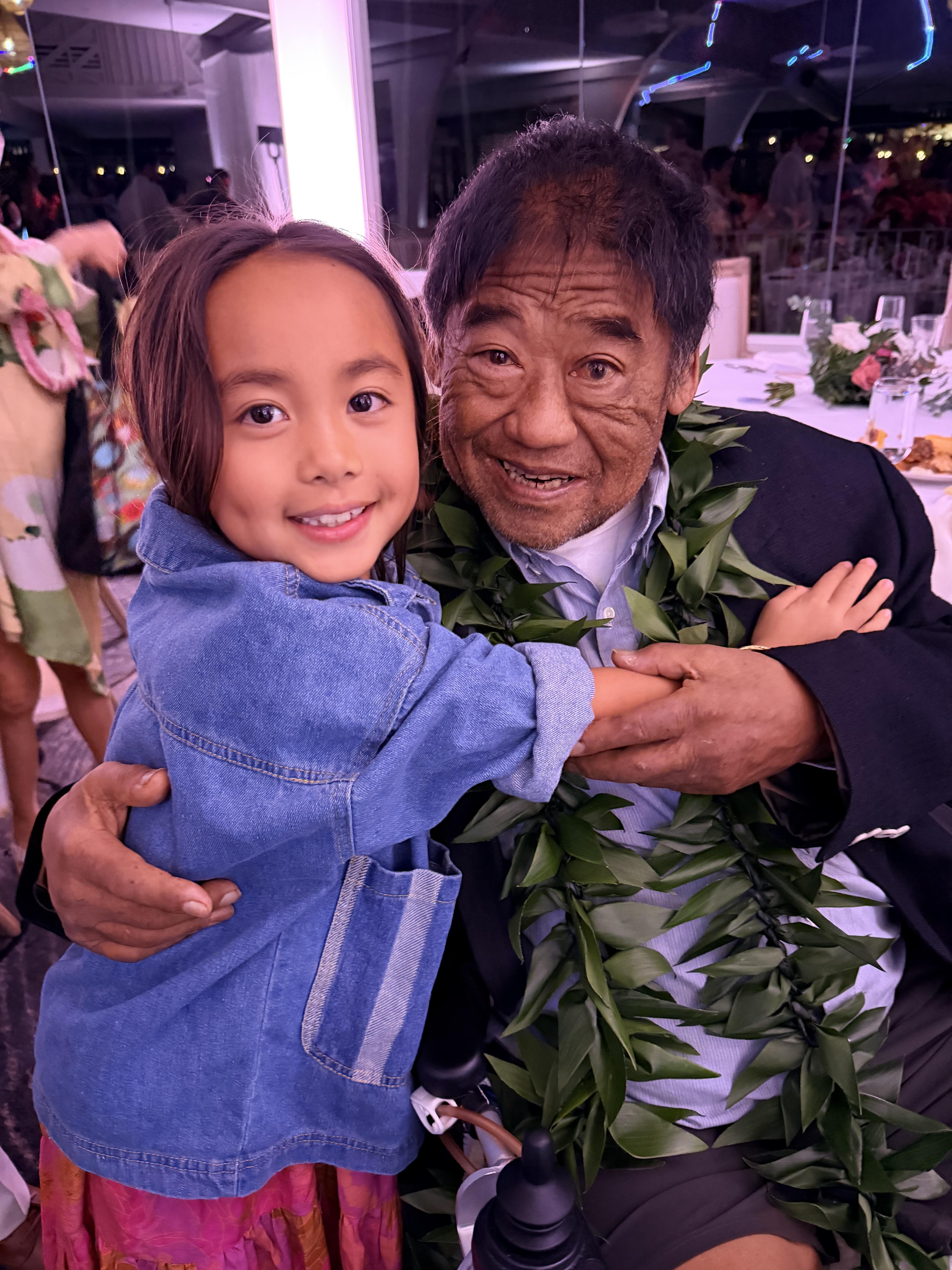 A man and child posing for a picture