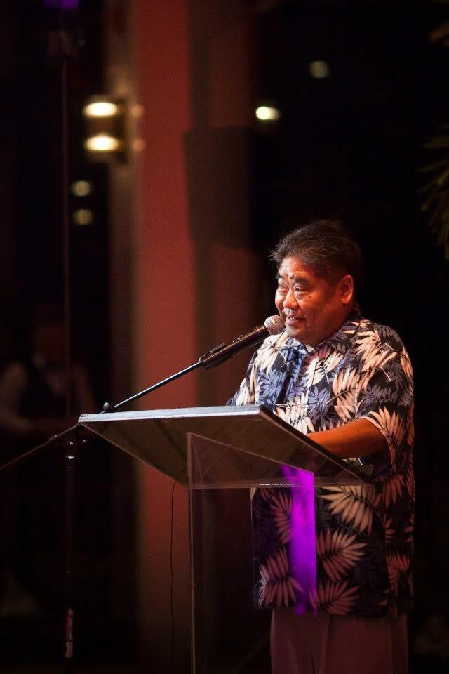 A man speaking into a microphone
