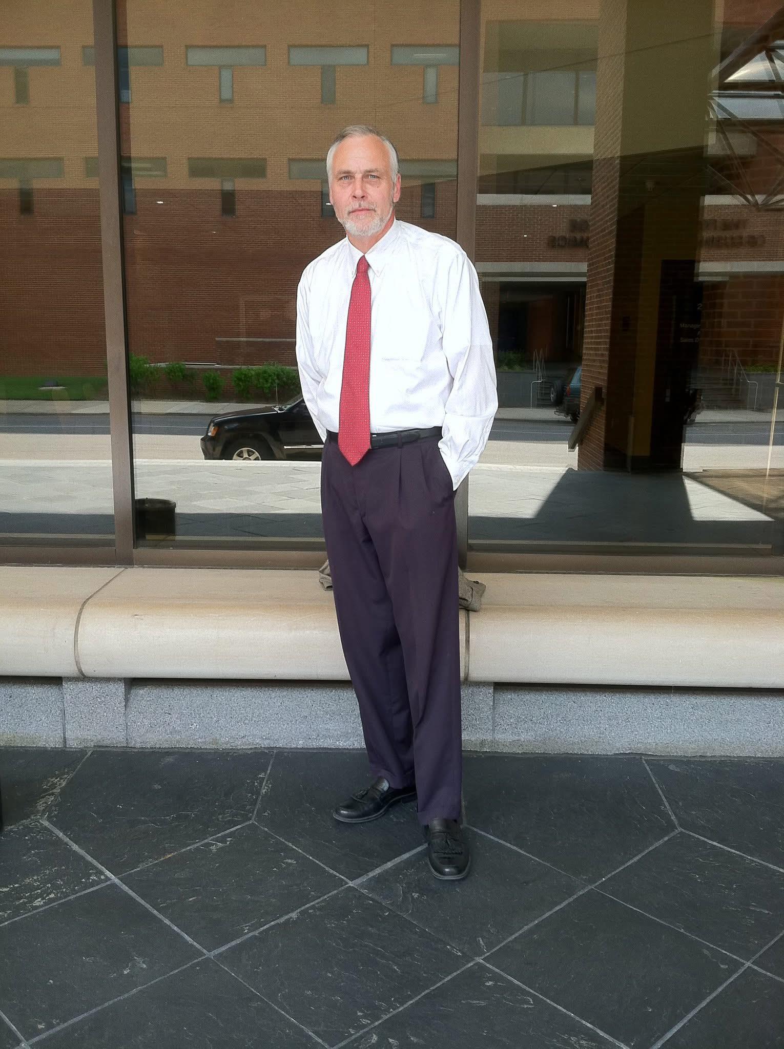 A man standing on a bench