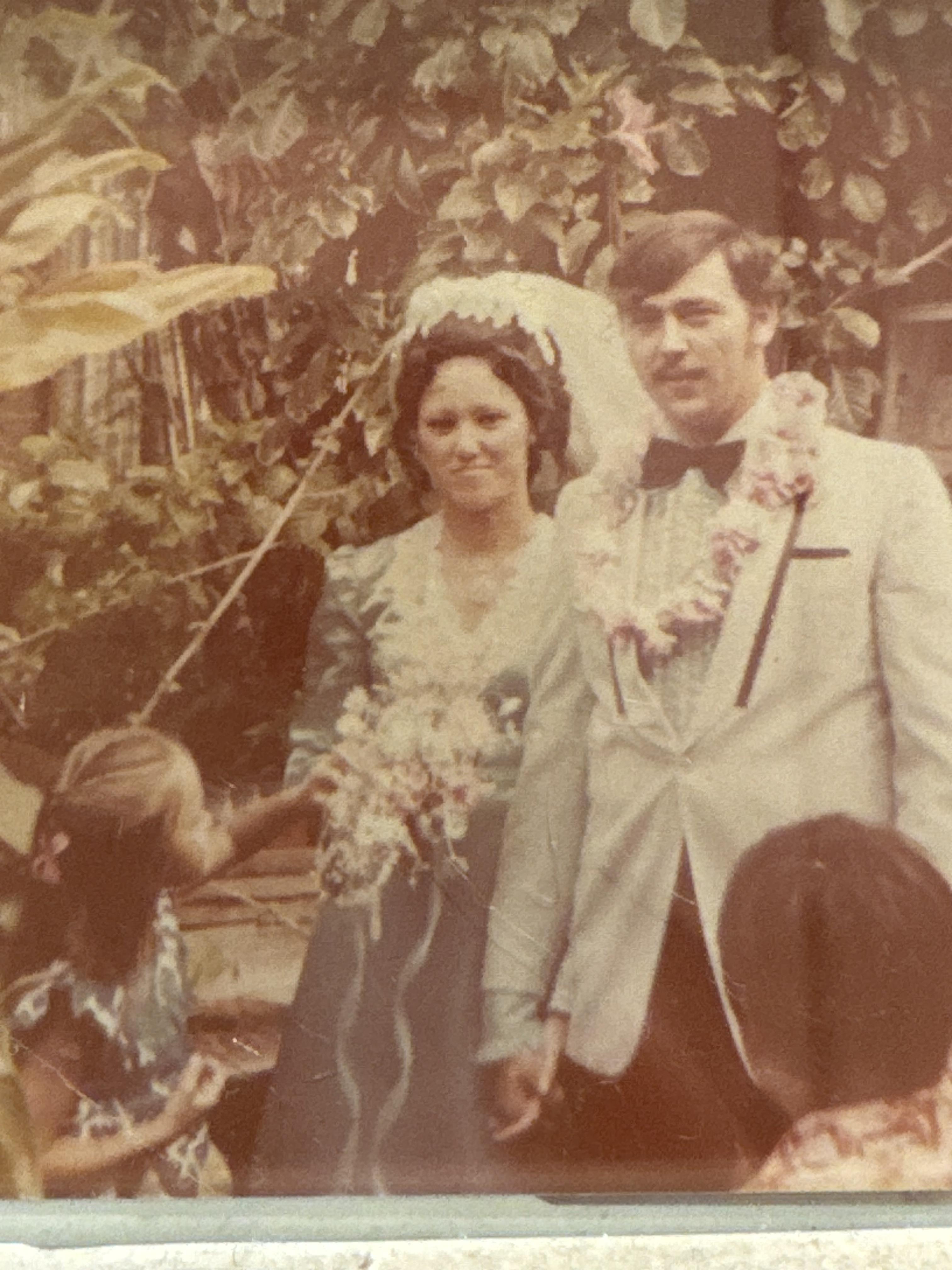 A man and woman in wedding attire