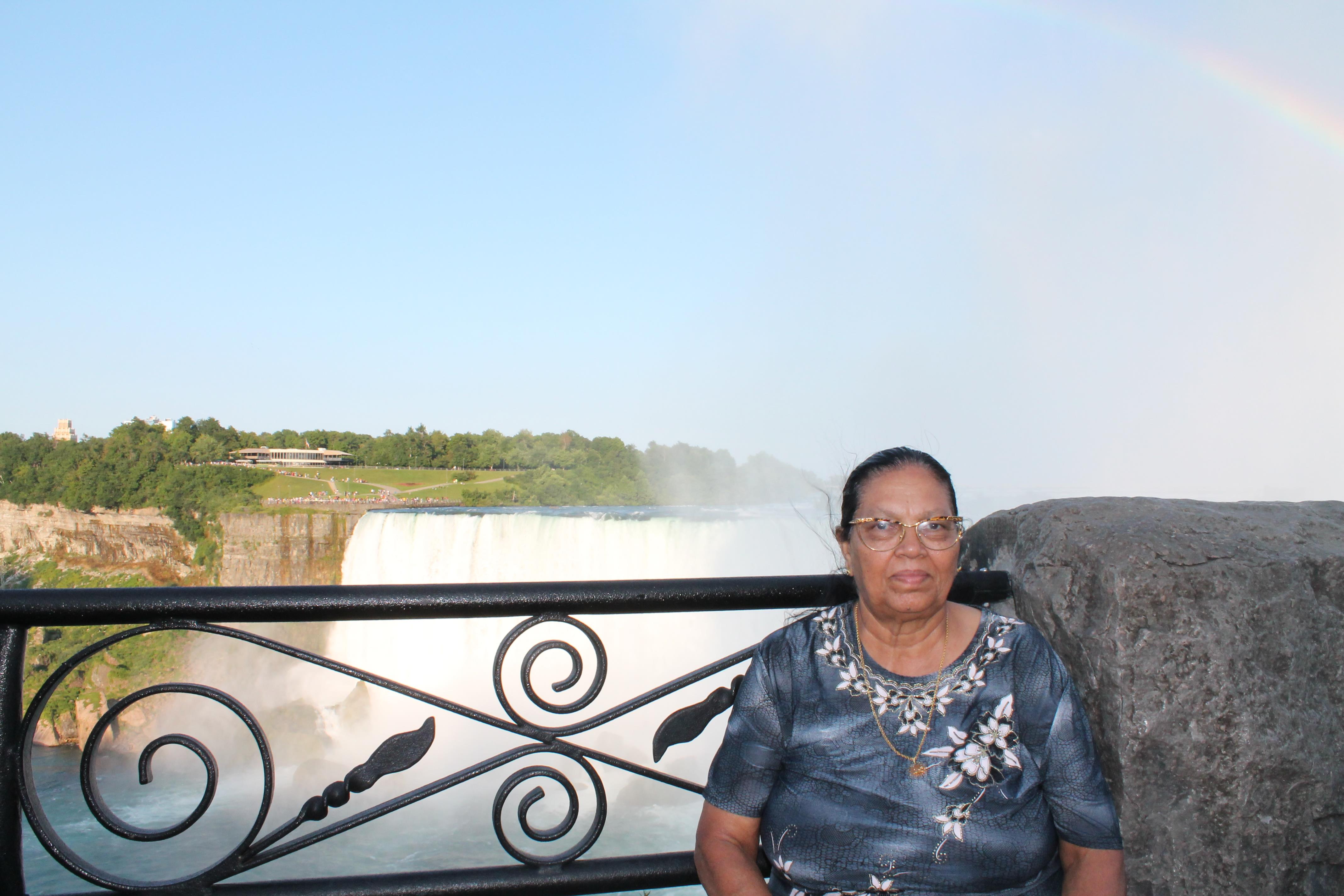 A woman sitting on a bridge