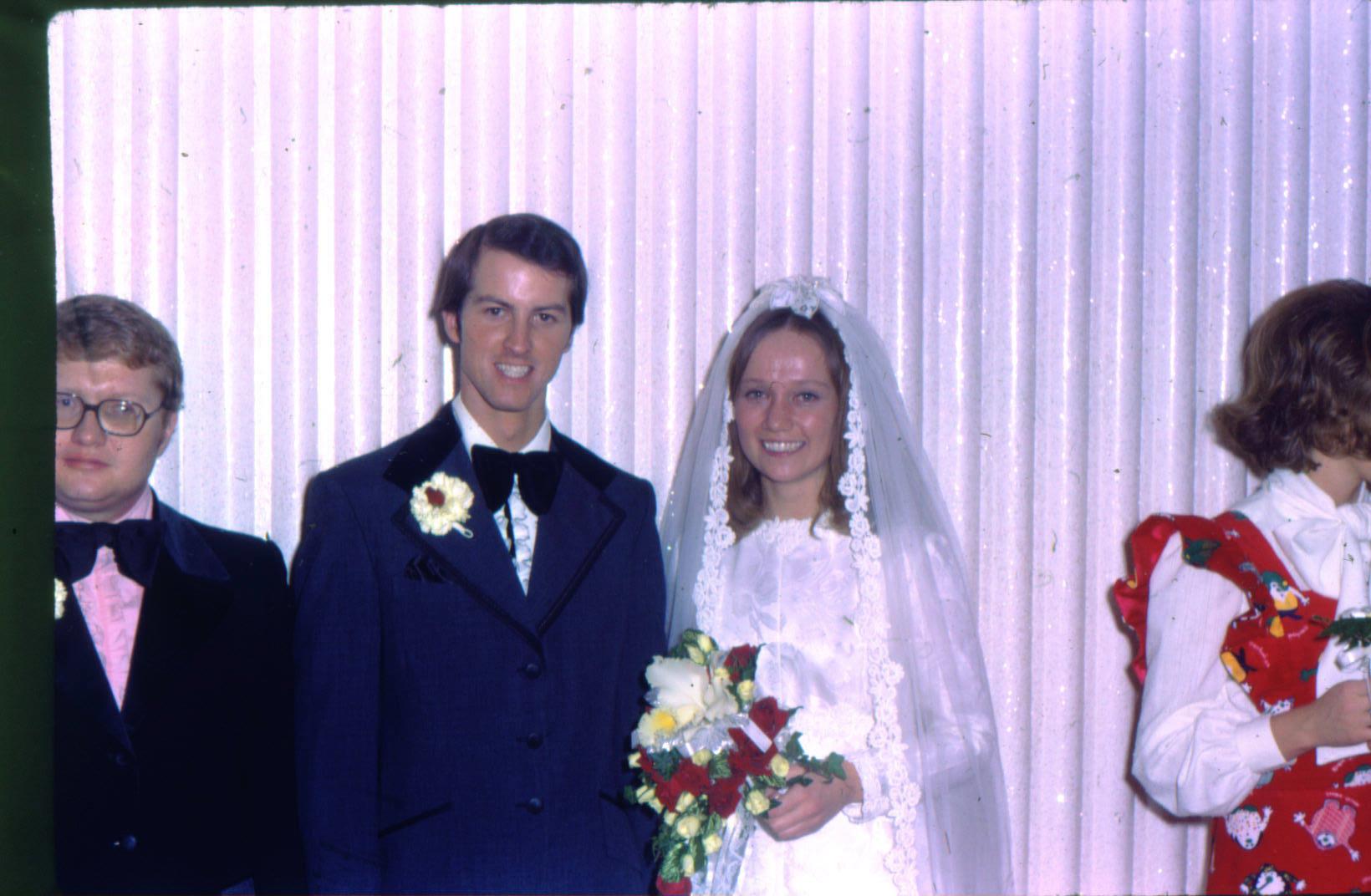 A man and woman in wedding attire