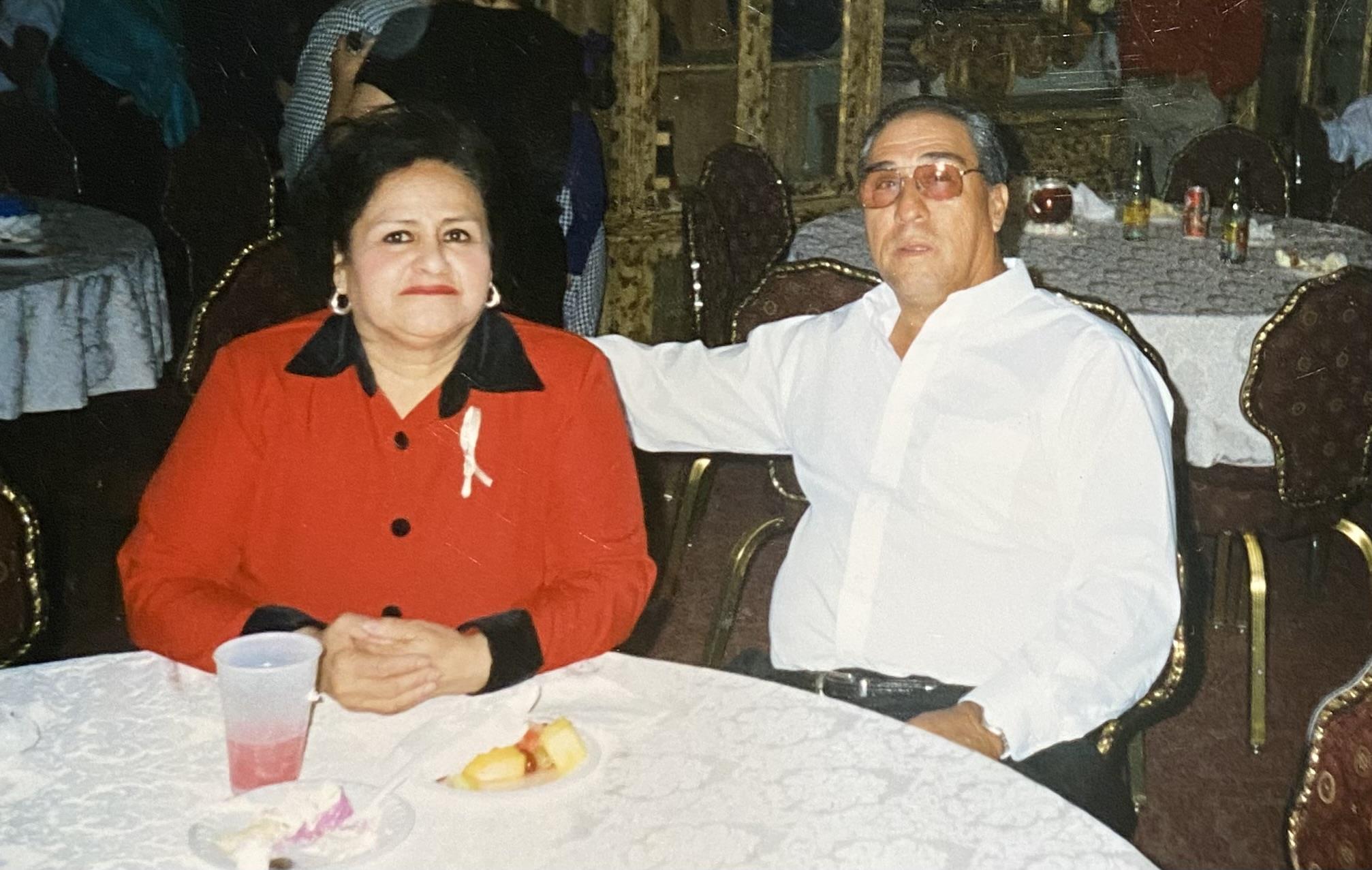 A man and woman sitting at a table