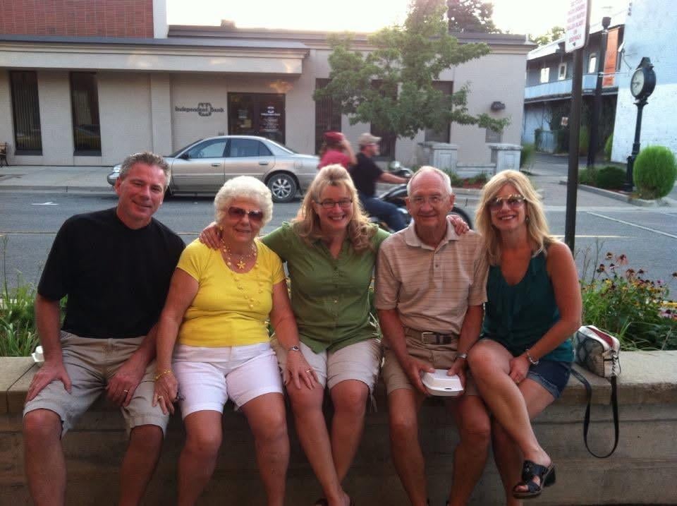 A group of people sitting on a bench